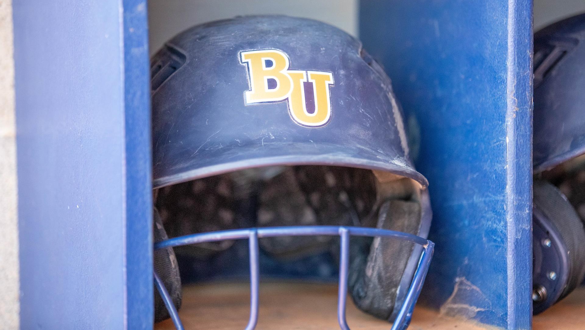 Bethel softball helmet sitting in the dugout