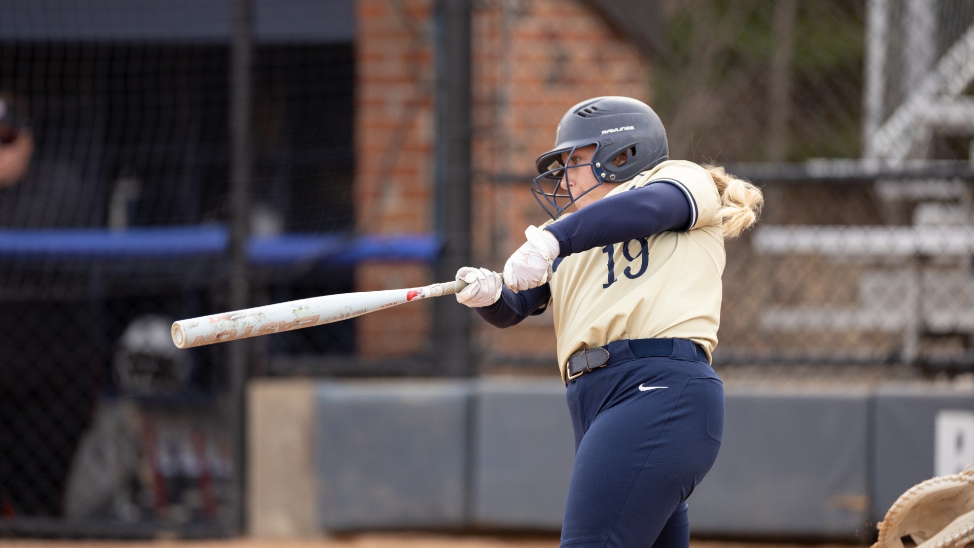 Ellie Baker finishes her swing