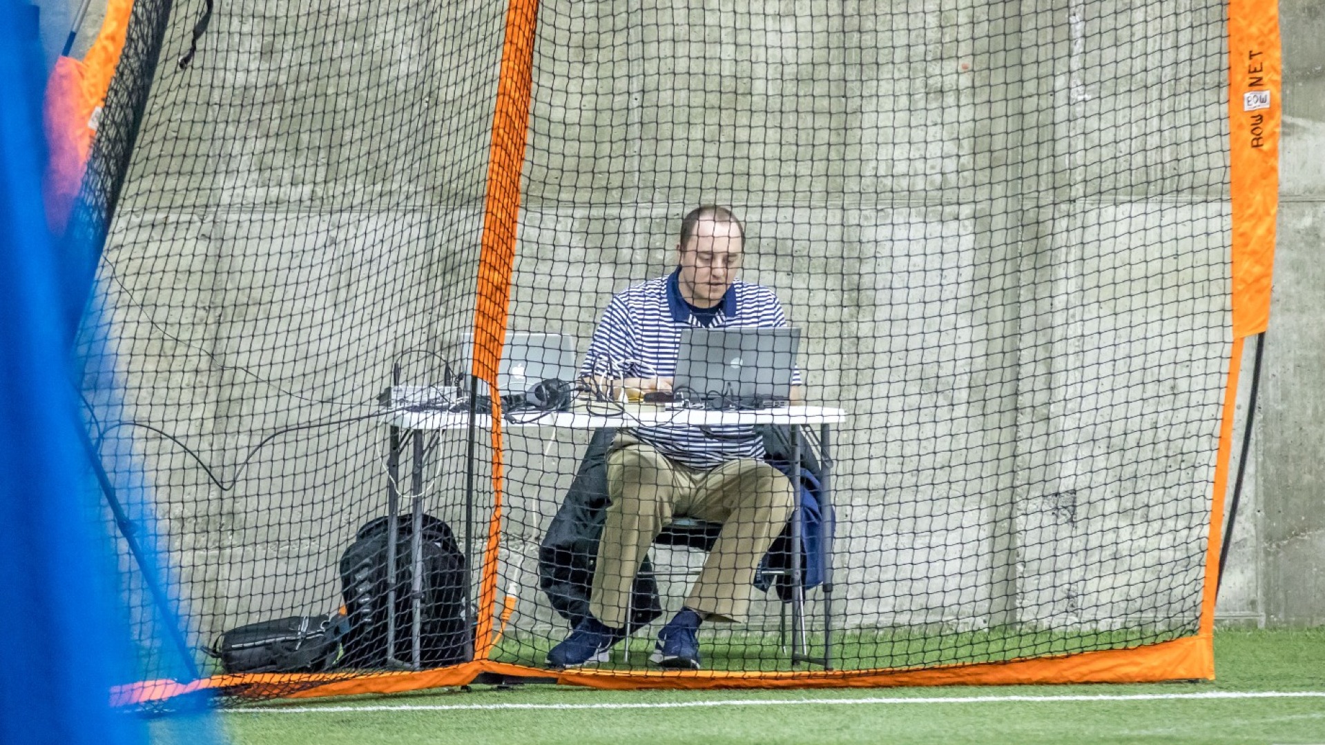 SID Austin Lagesse is keeping score at a indoor softball game