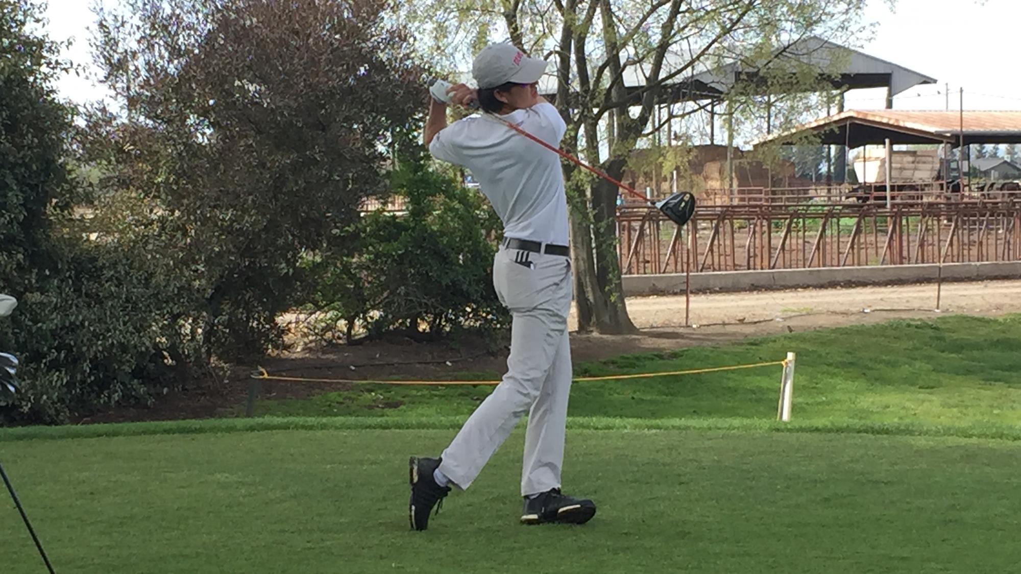  Austin Bishop swings a club