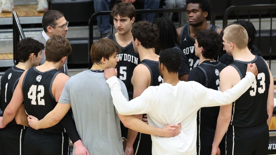 Men's Basketball huddle