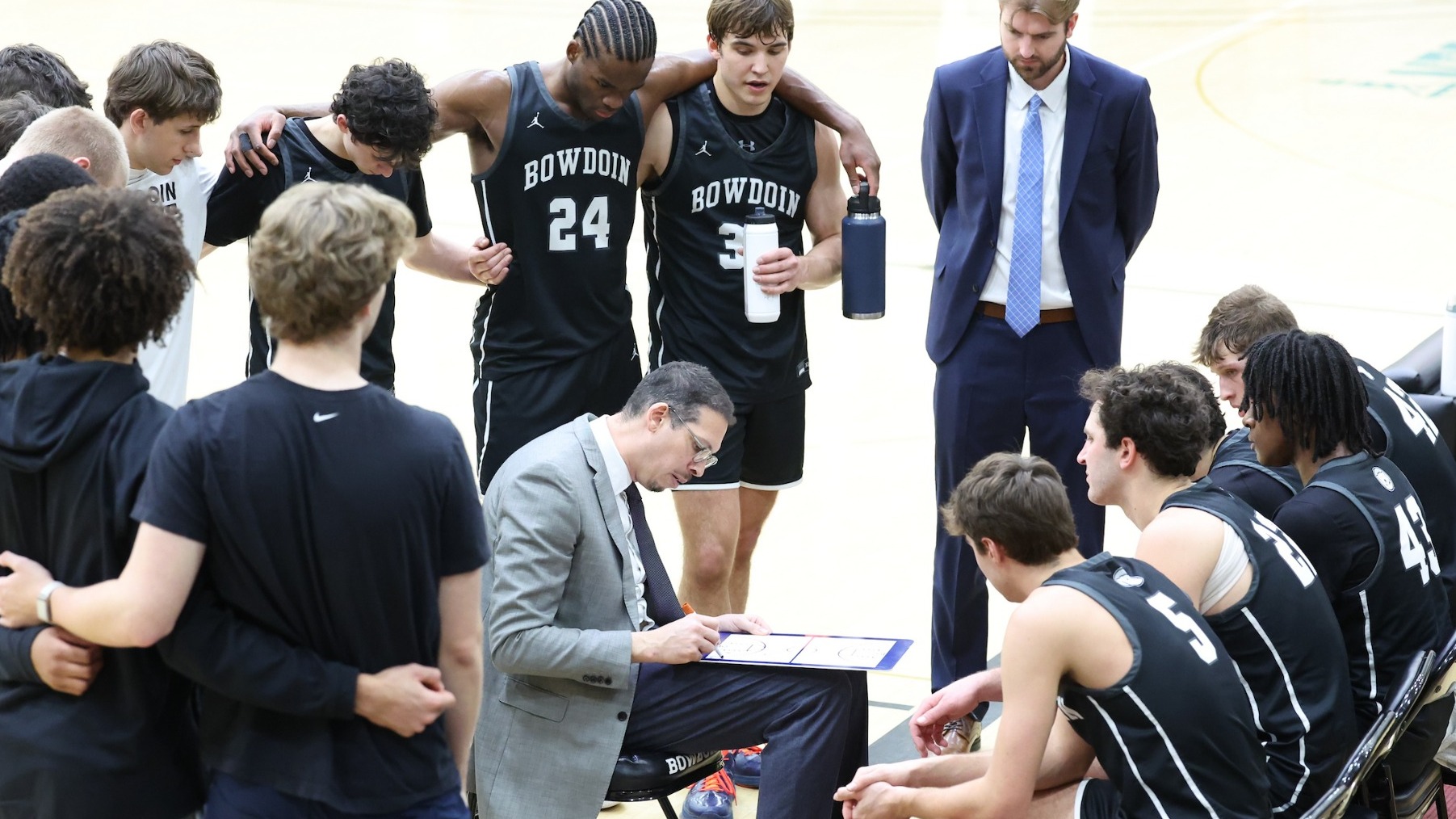 Men's Basketball huddle