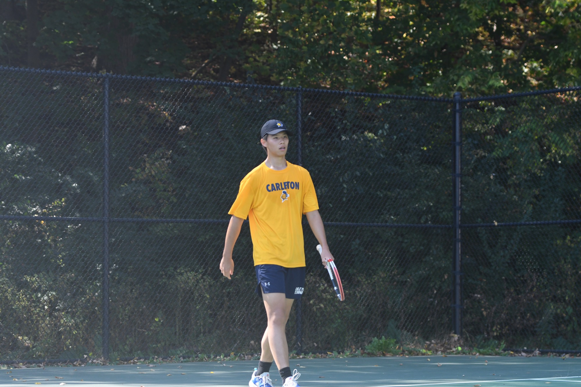 Yihe Zhang walks down the court