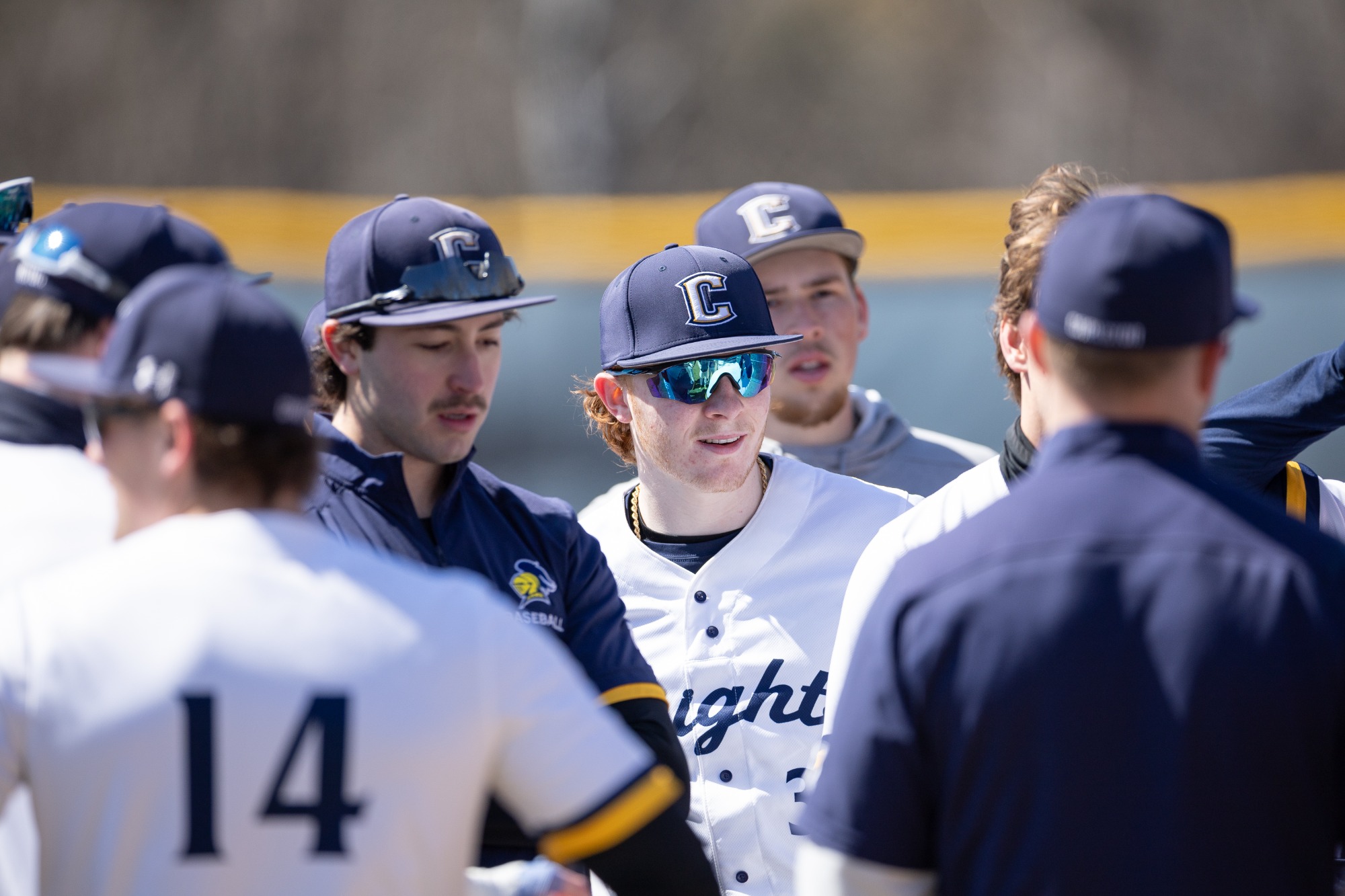 Team huddles before the game starts