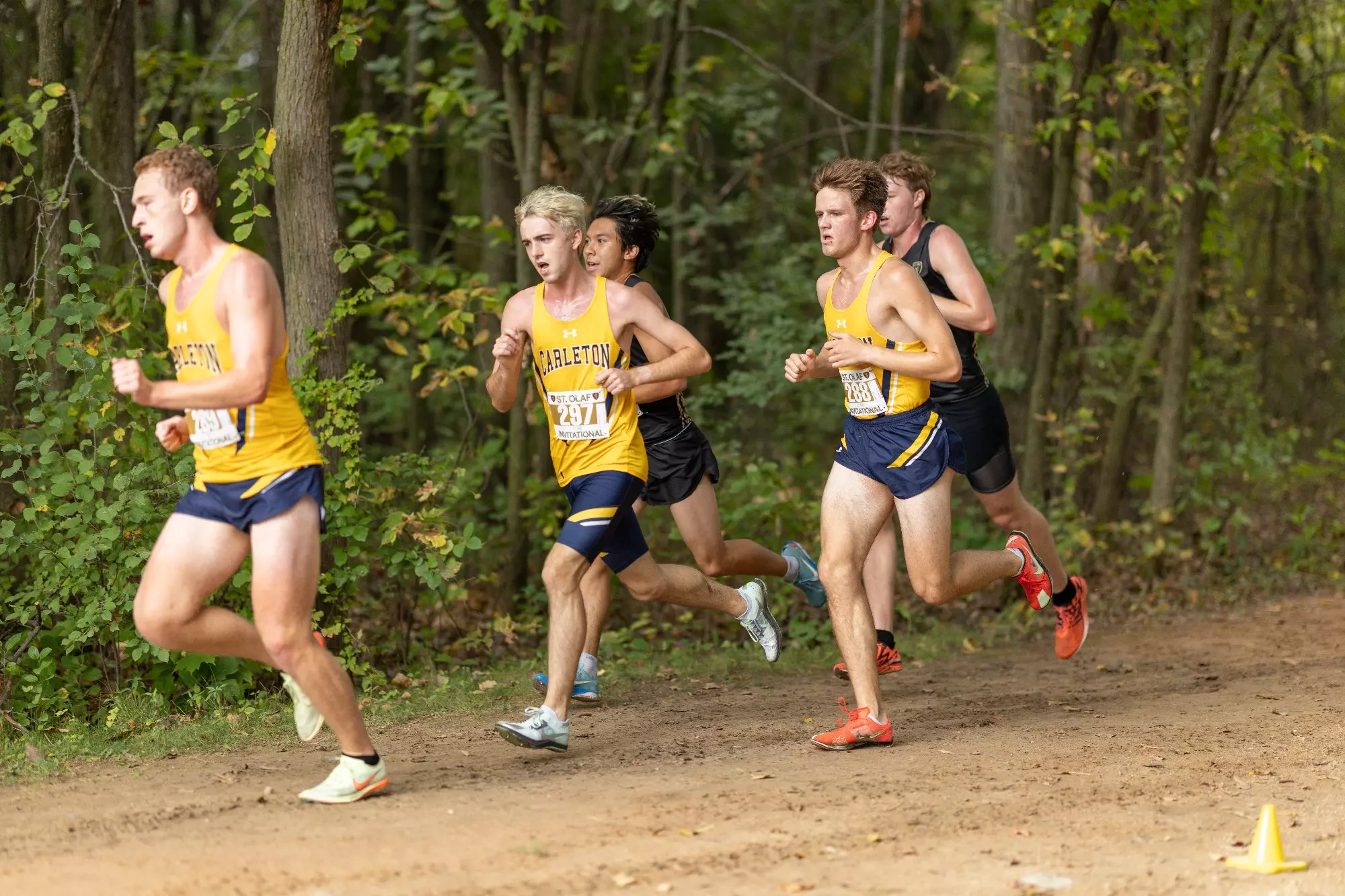 Andrew Jamison, Kyle Thompson, and Jacob Hopkins among a group of runners during a race