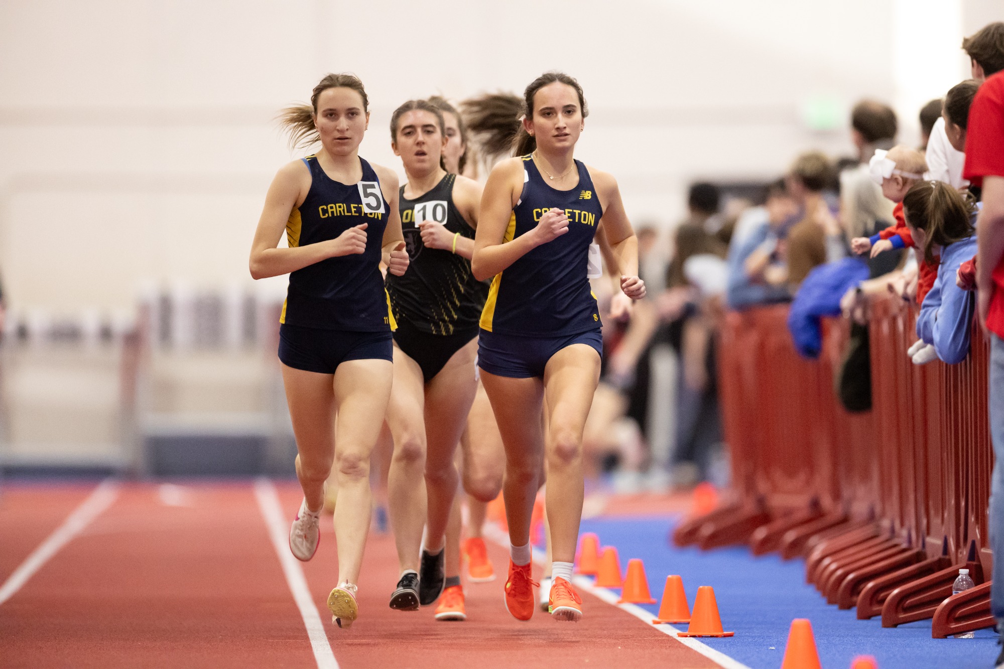 Aliya Larsen and Hannah Preisser lead a pack of runners.