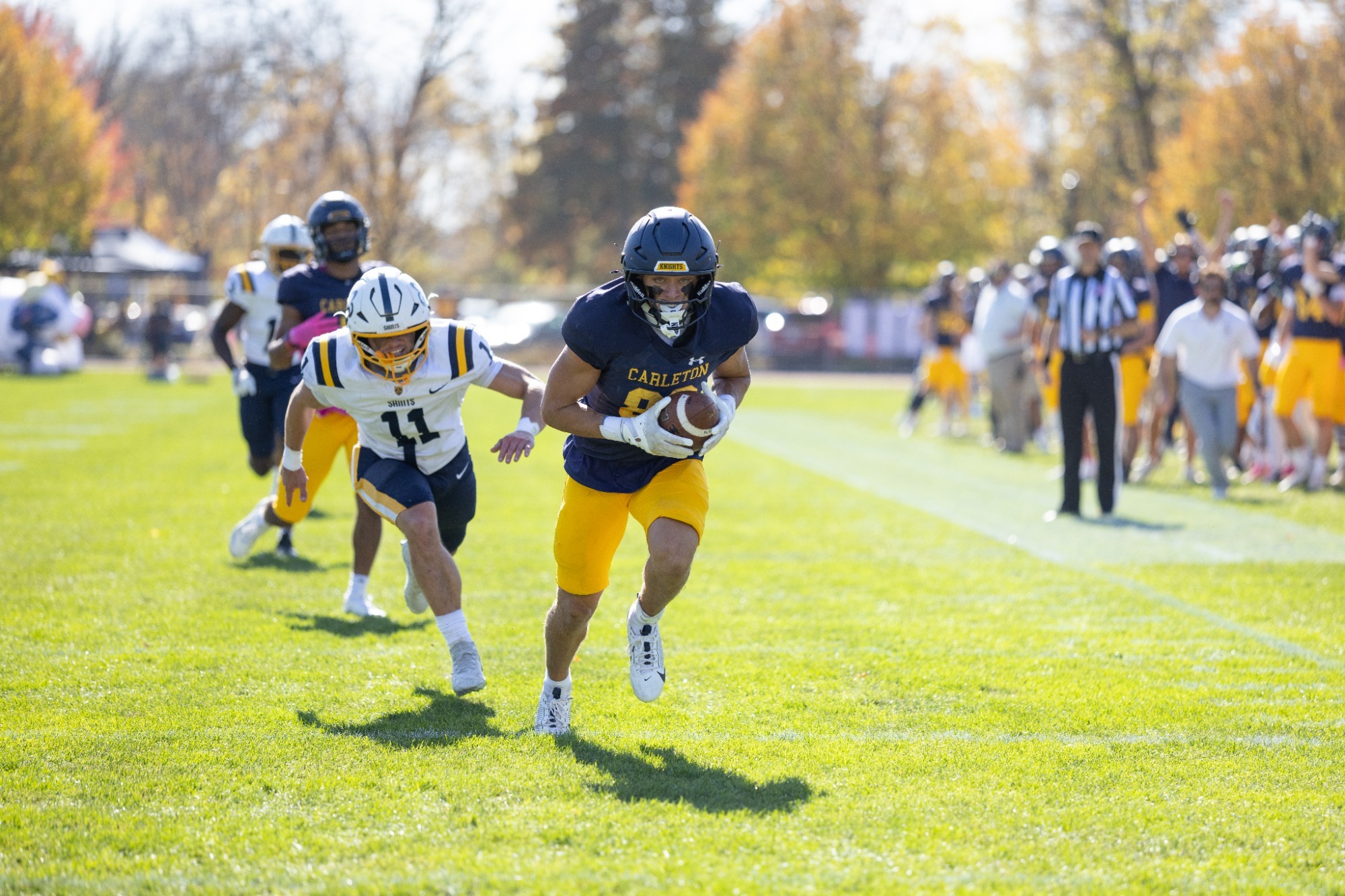 Tyler Dimond runs with the football after a catch