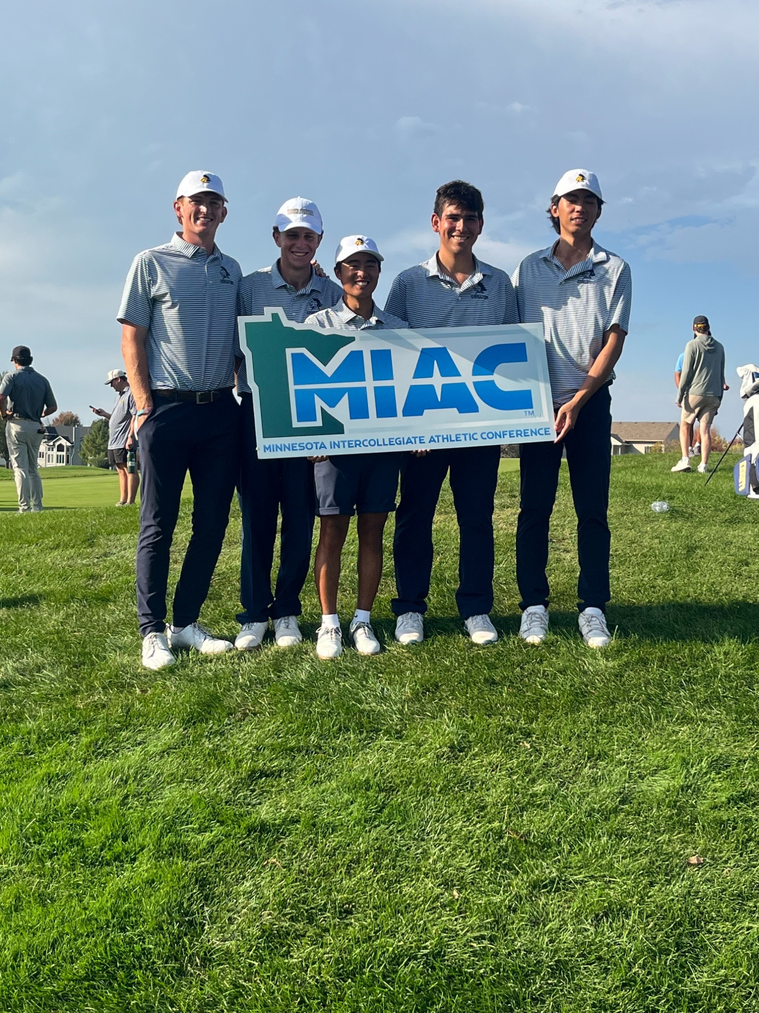 The men's golf team poses for a team picture following the 2026 MIAC Championships