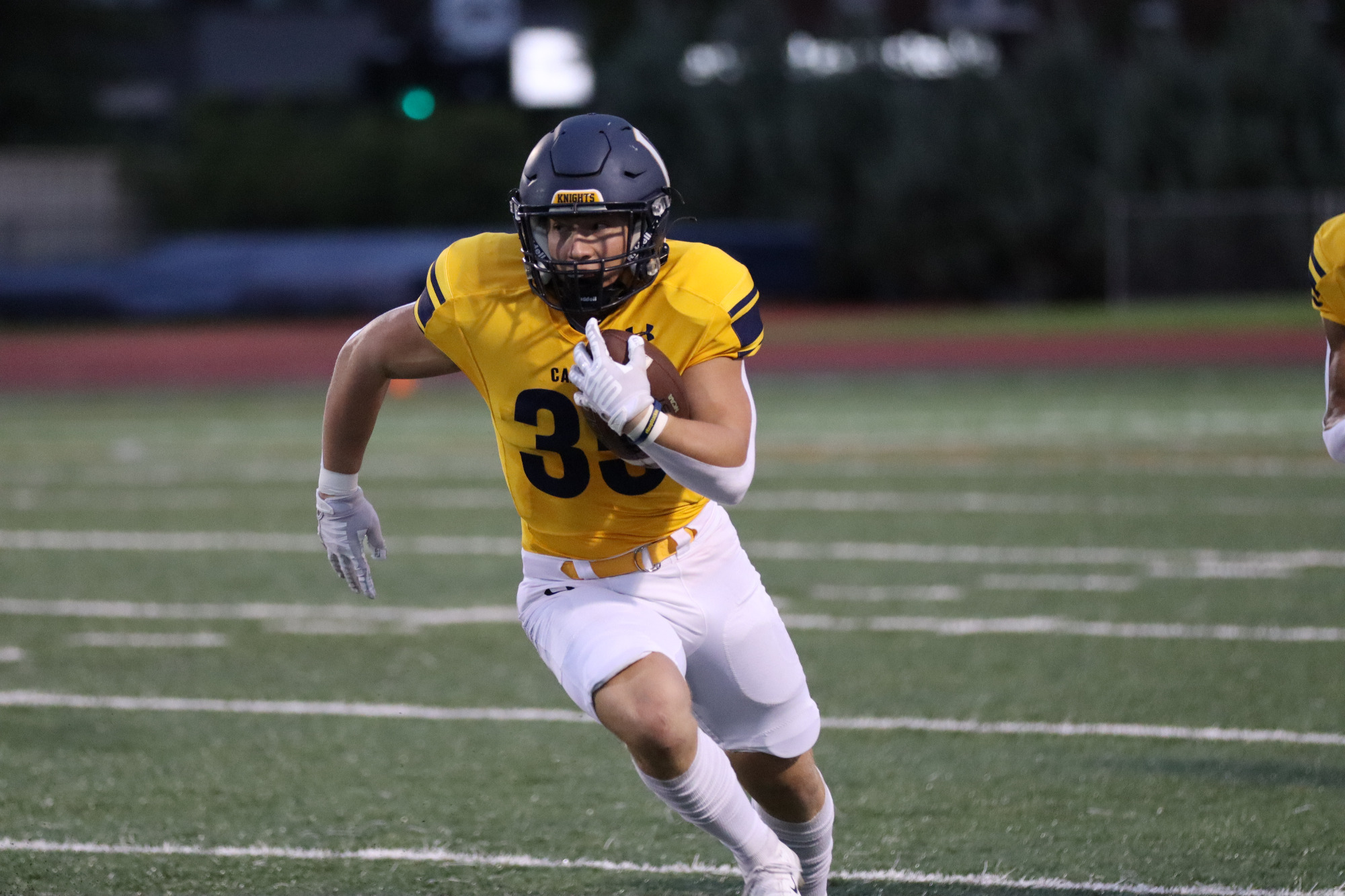 Evan Olds running with the football