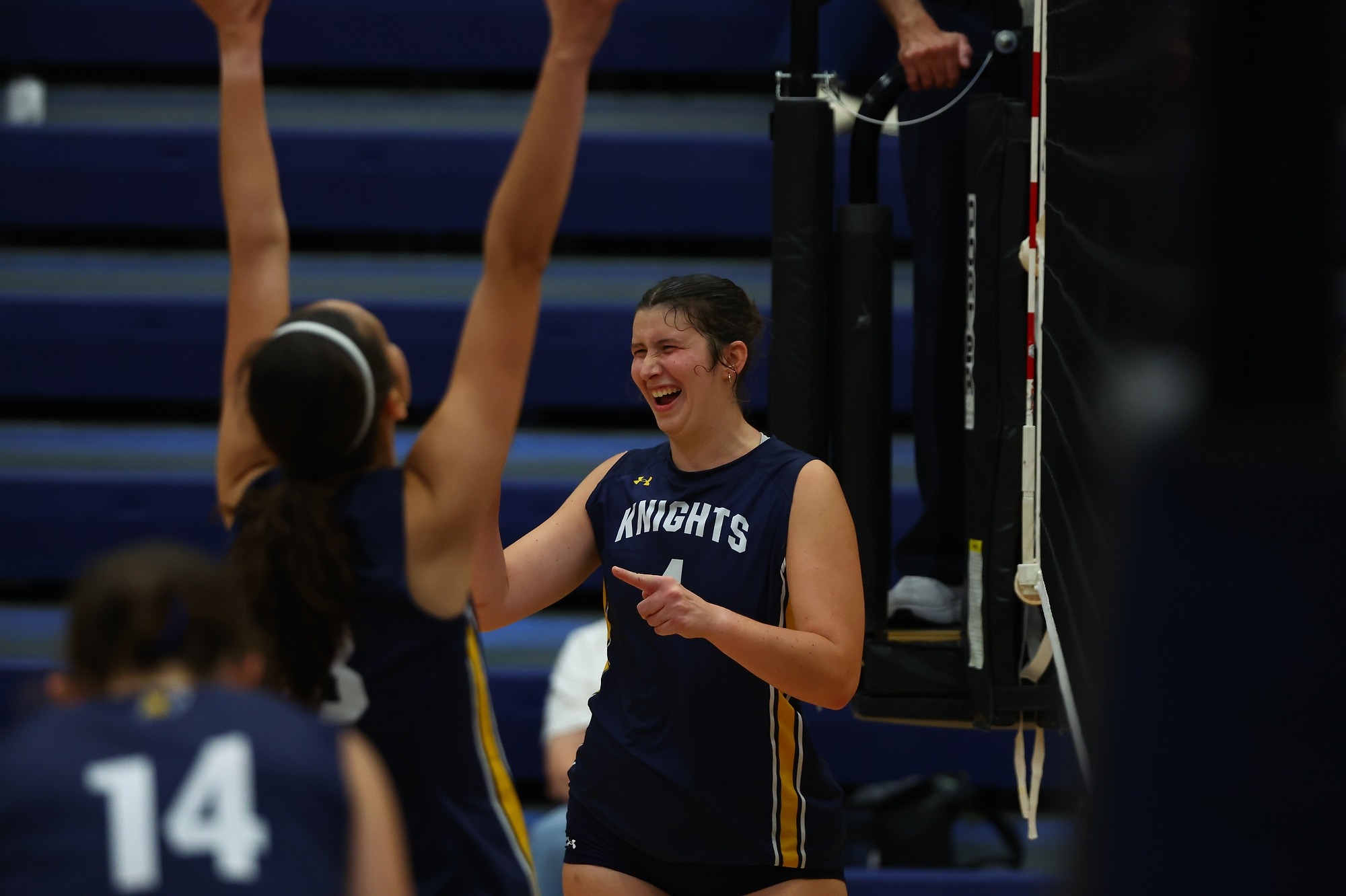 Rachel Bingham celebrates a kill with her teammates