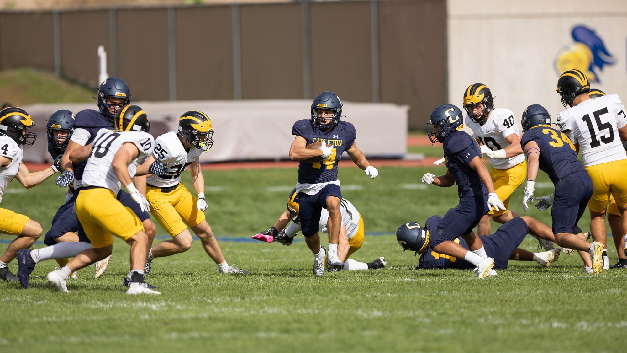 Cooper Pollard runs with the football