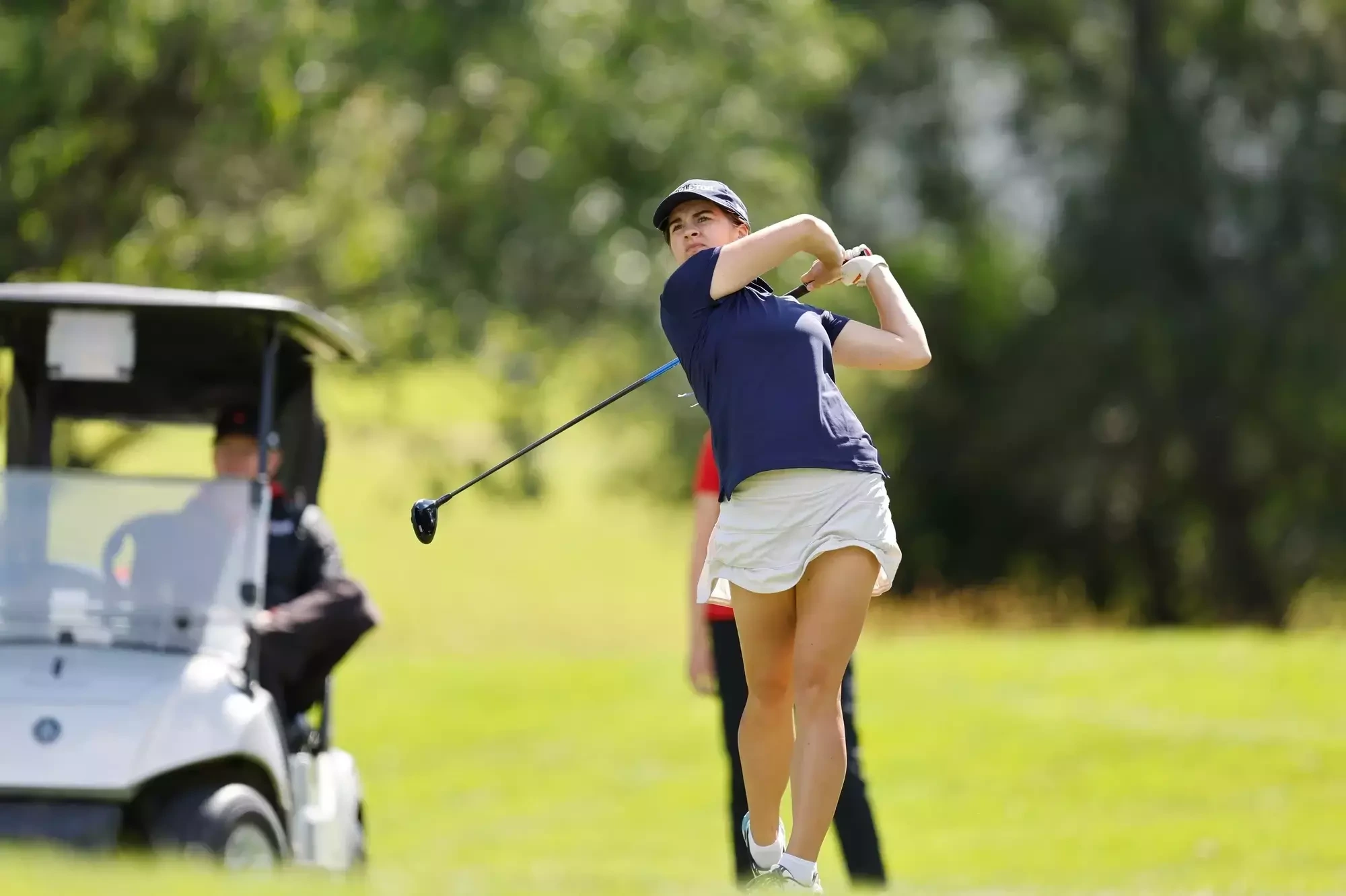 Natalie Tatar follows through after hitting a shot