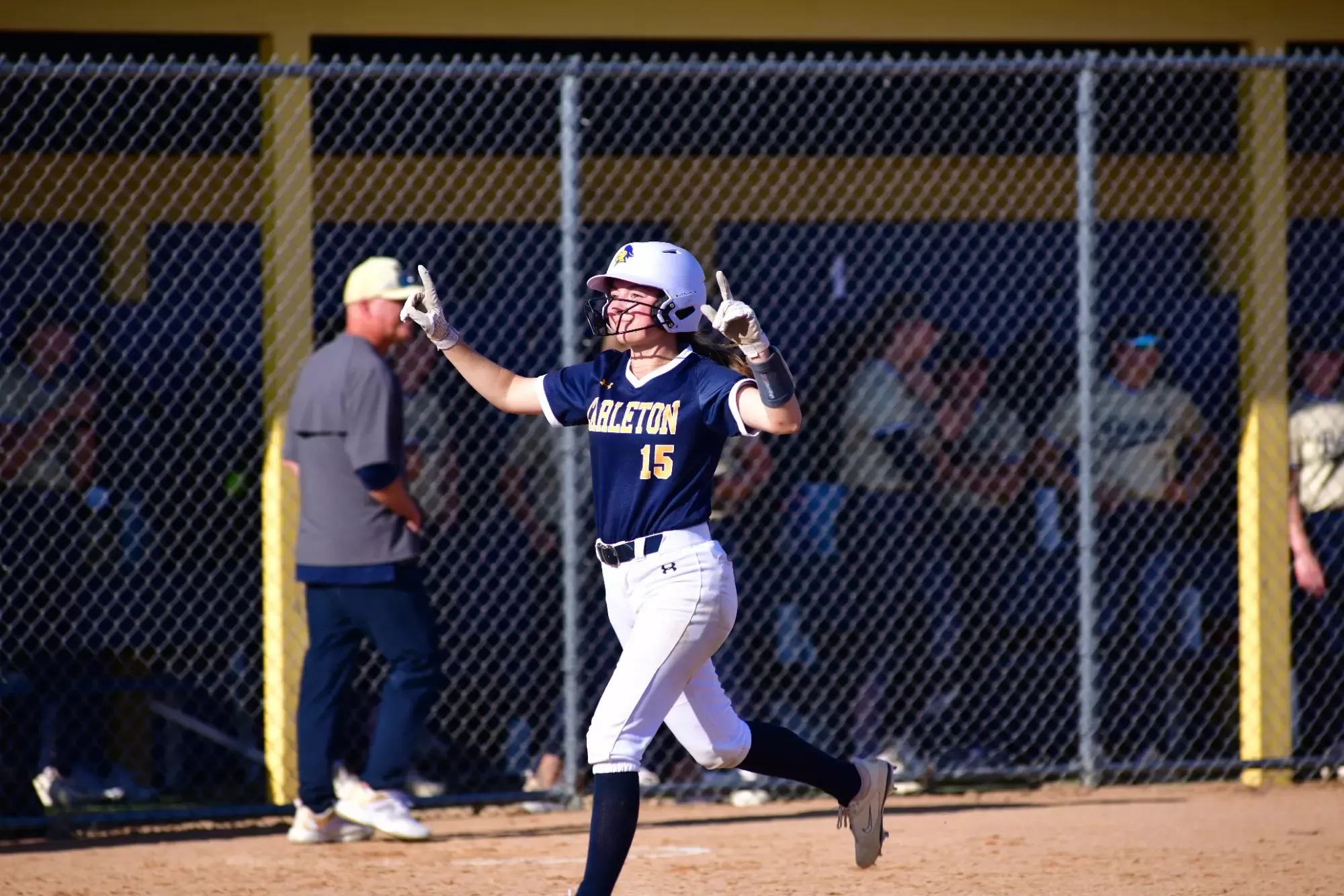 Gloria Hronek celebrates the winning run.