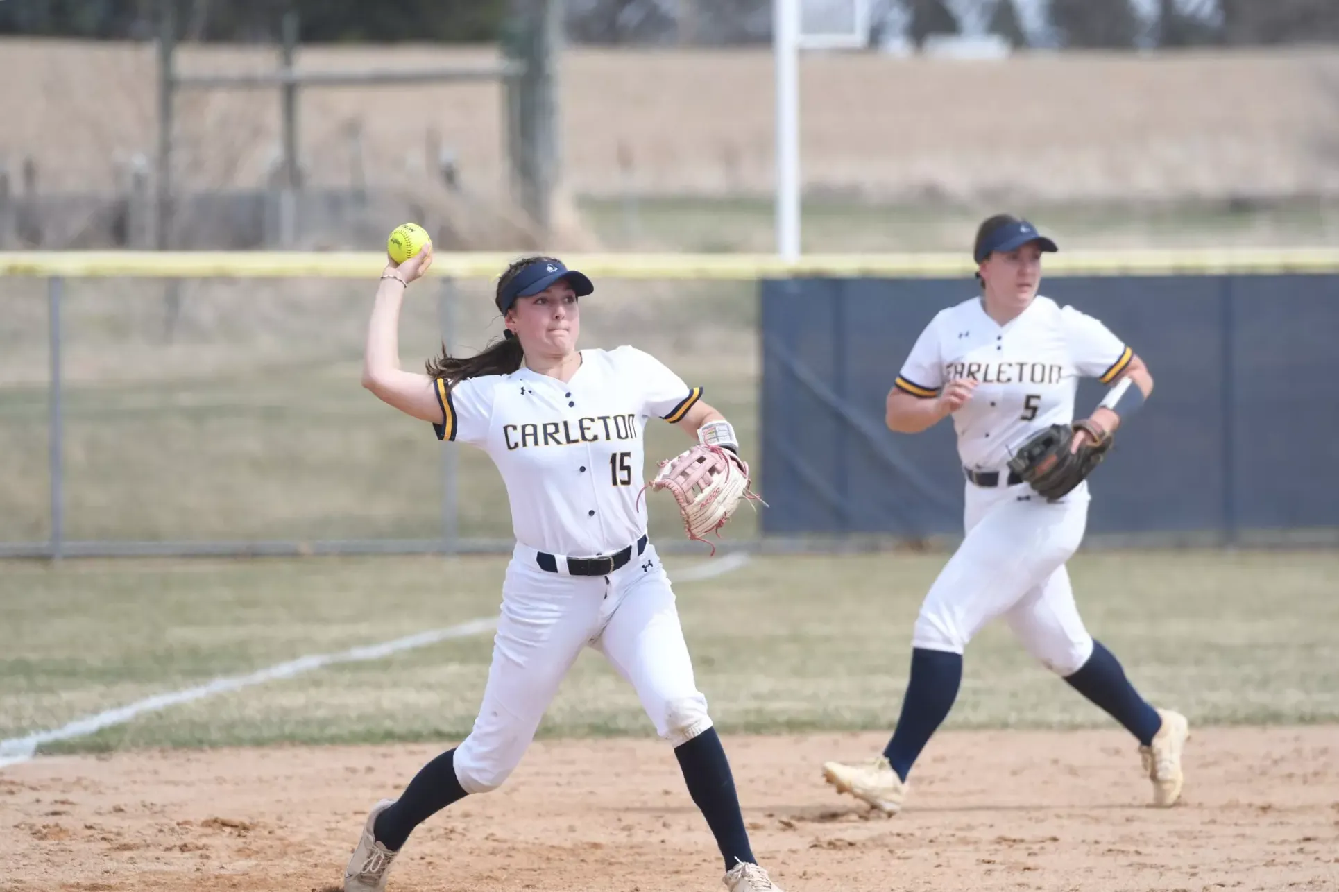 Gloria Hronek throws to first base.