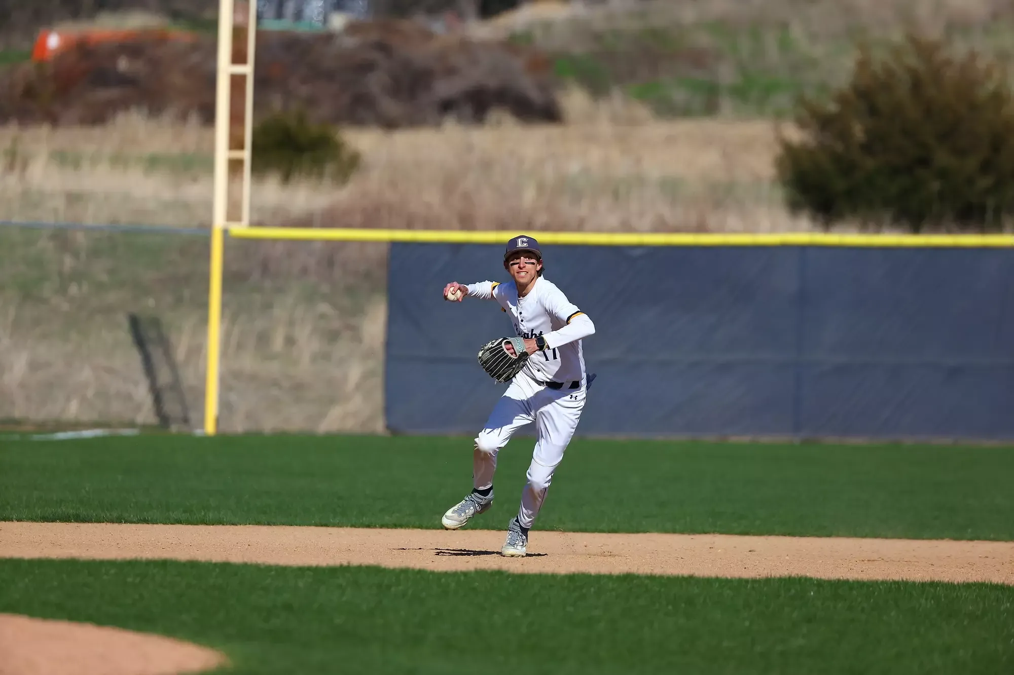 Andrew Sellers pulls back to throw the ball from short stop.