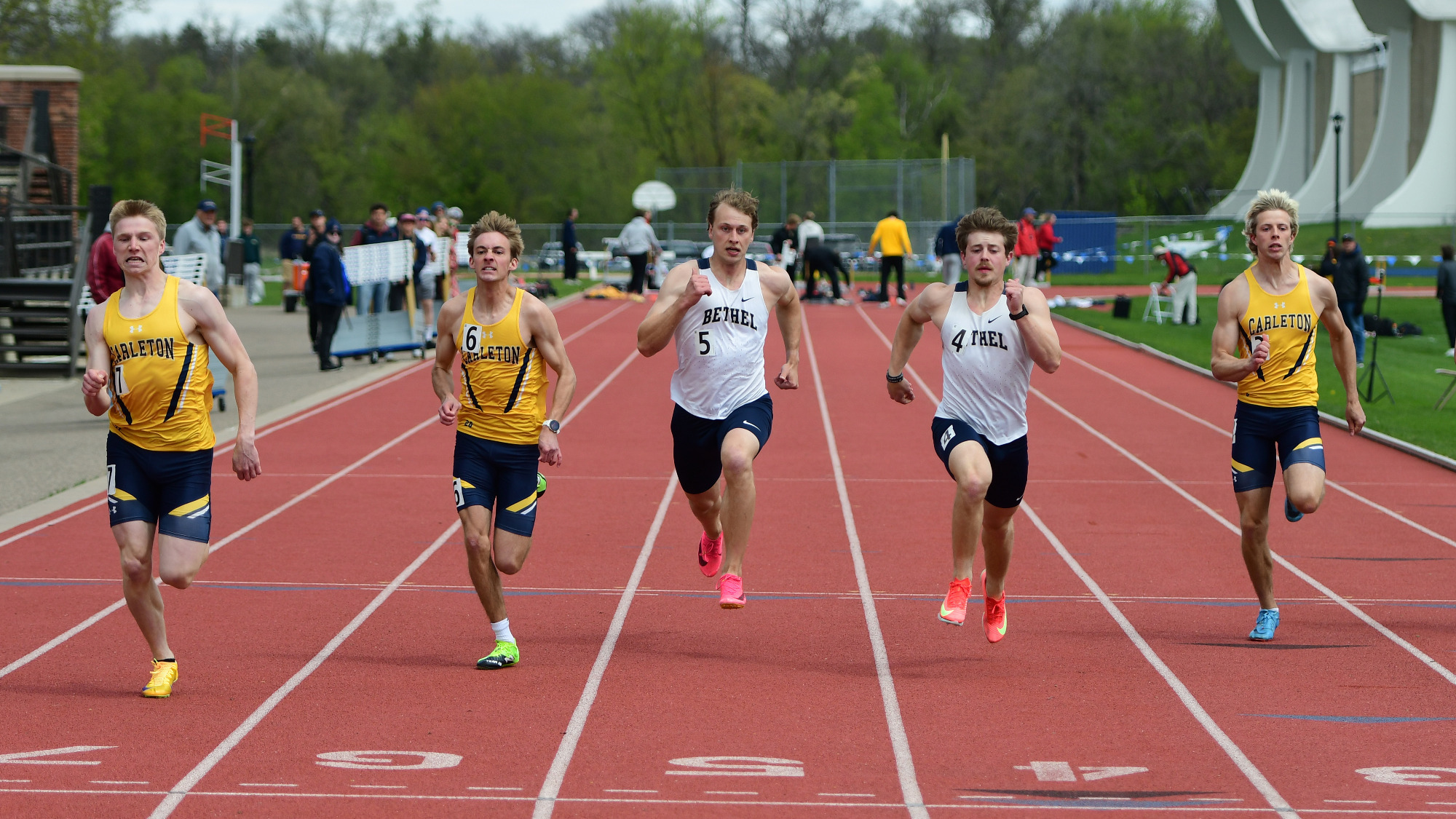 Soren Kaster, Reed White, Reese Anderson and two other runners sprint toward the finish line.