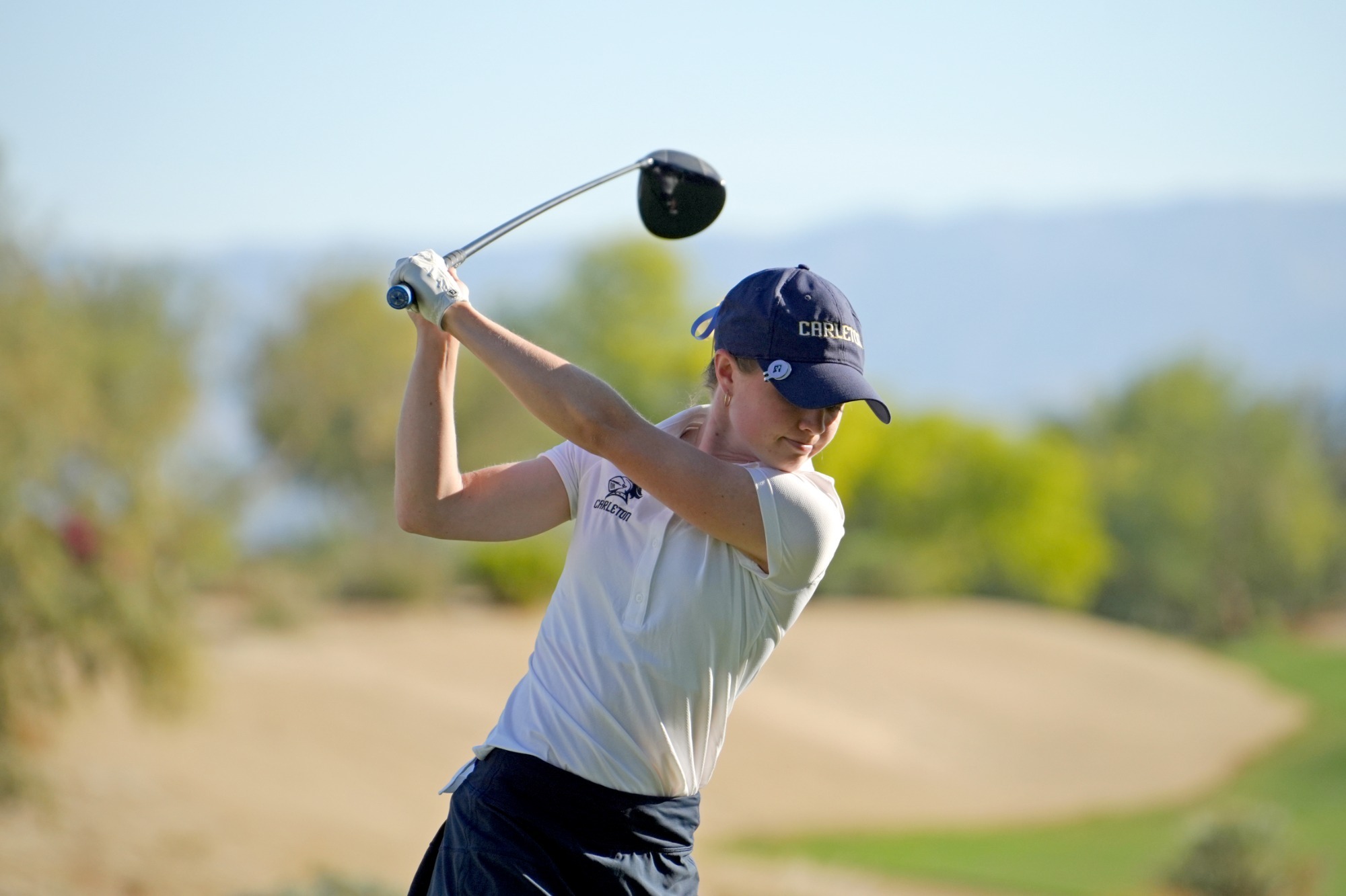 Carter Sichol focuses on the top of her back swing