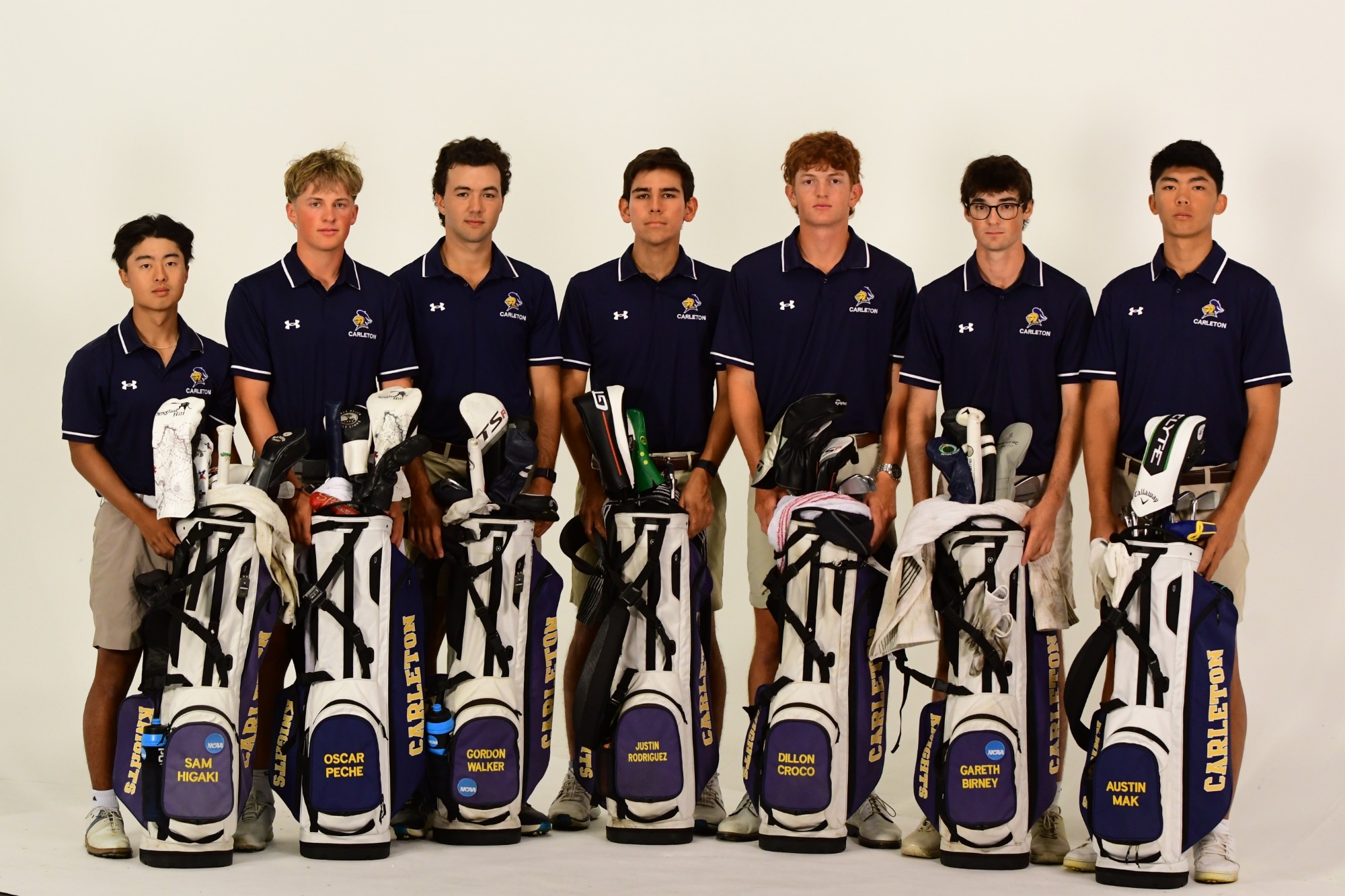 Men's Golf Team poses with their golf bags