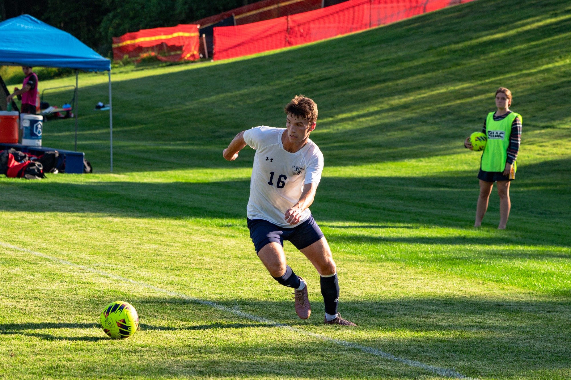Riley Jones controls the ball in the corner