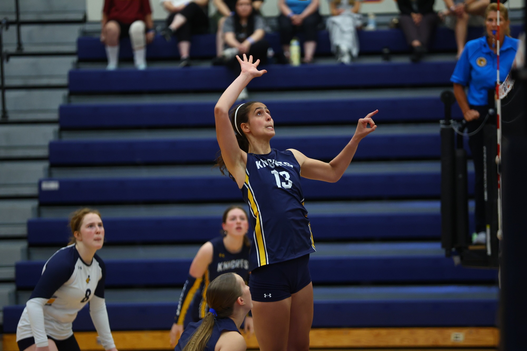 Jennifer Bricker attacks at the net at the Macalester Invite