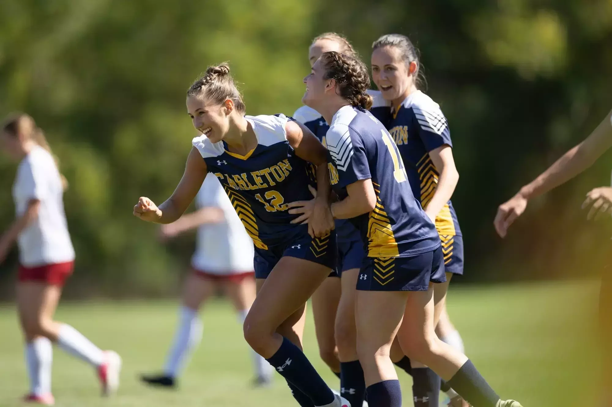 Zoe Silver (L) celebrates with her teammates after a goal