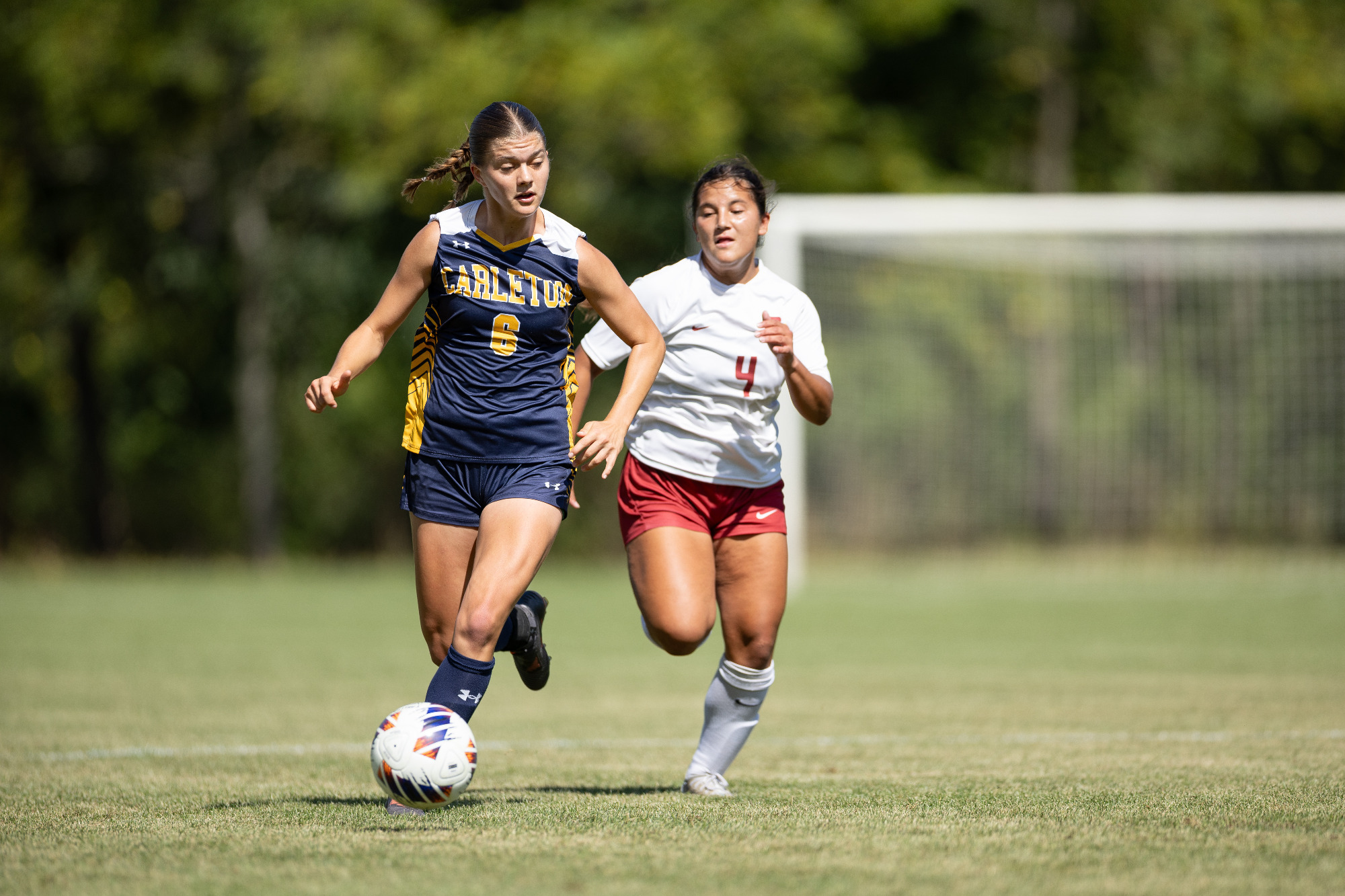 Eliza Barton dribbles up field
