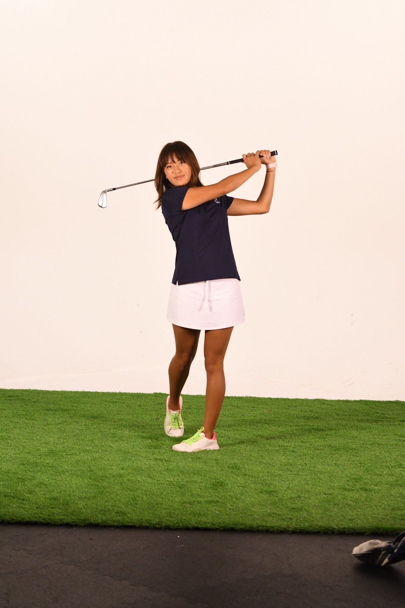 Cindy Yuan poses with her follow through