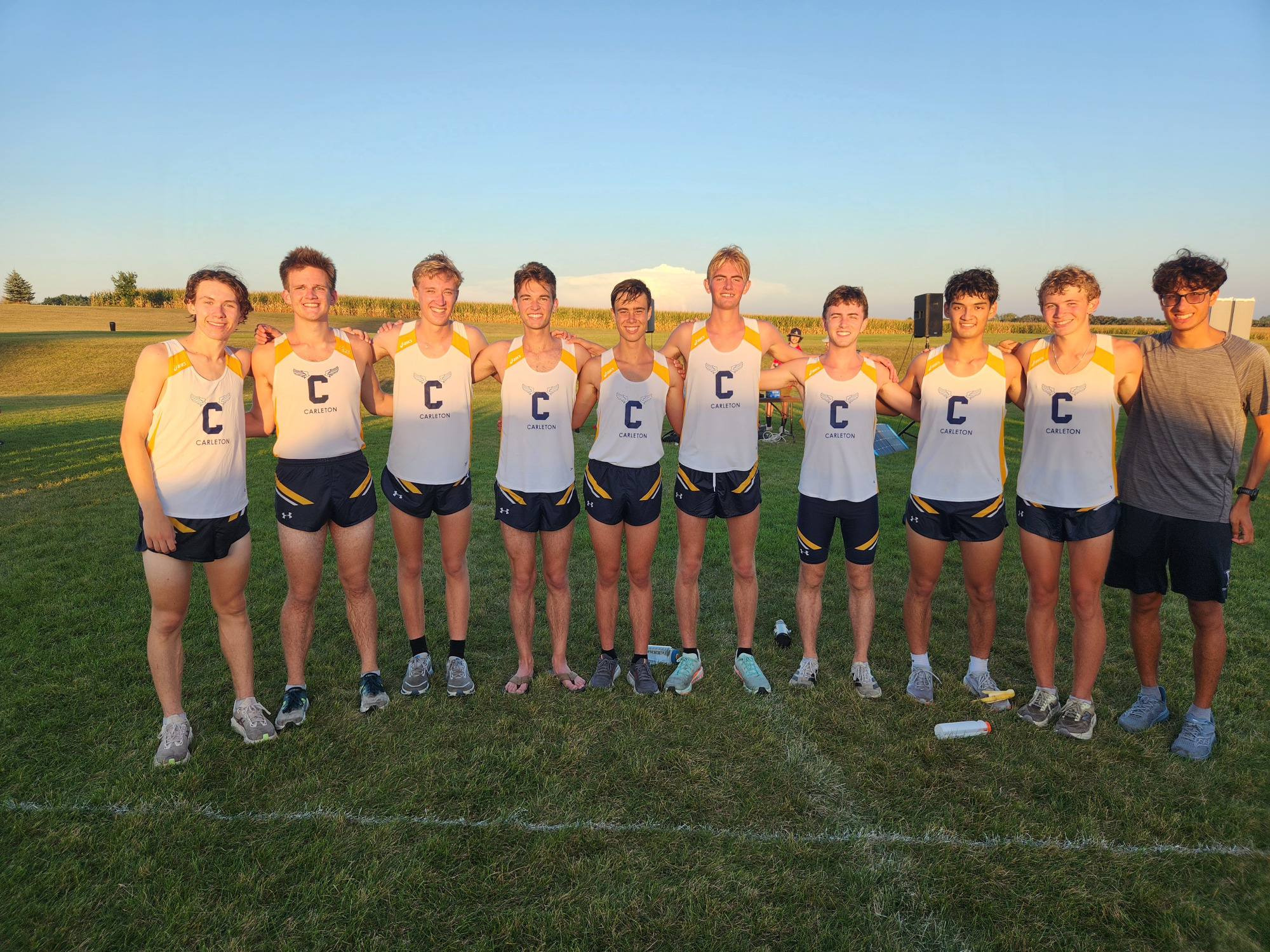 Several members of the men's cross country team standing together.
