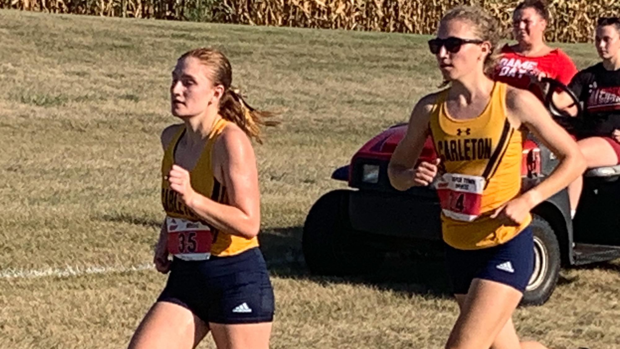 Lauren Tittel and Abigail Burns running a race.