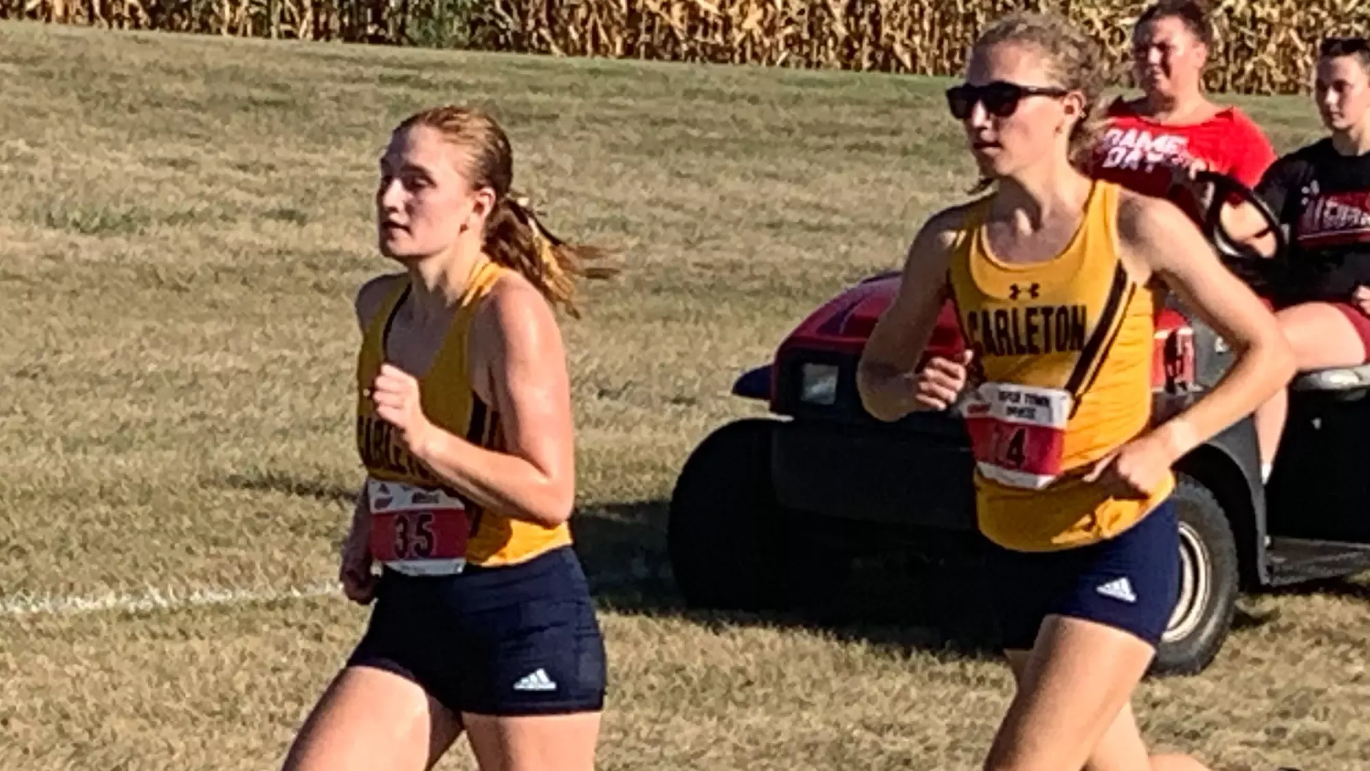 Lauren Tittel and Abigail Burns running a race.