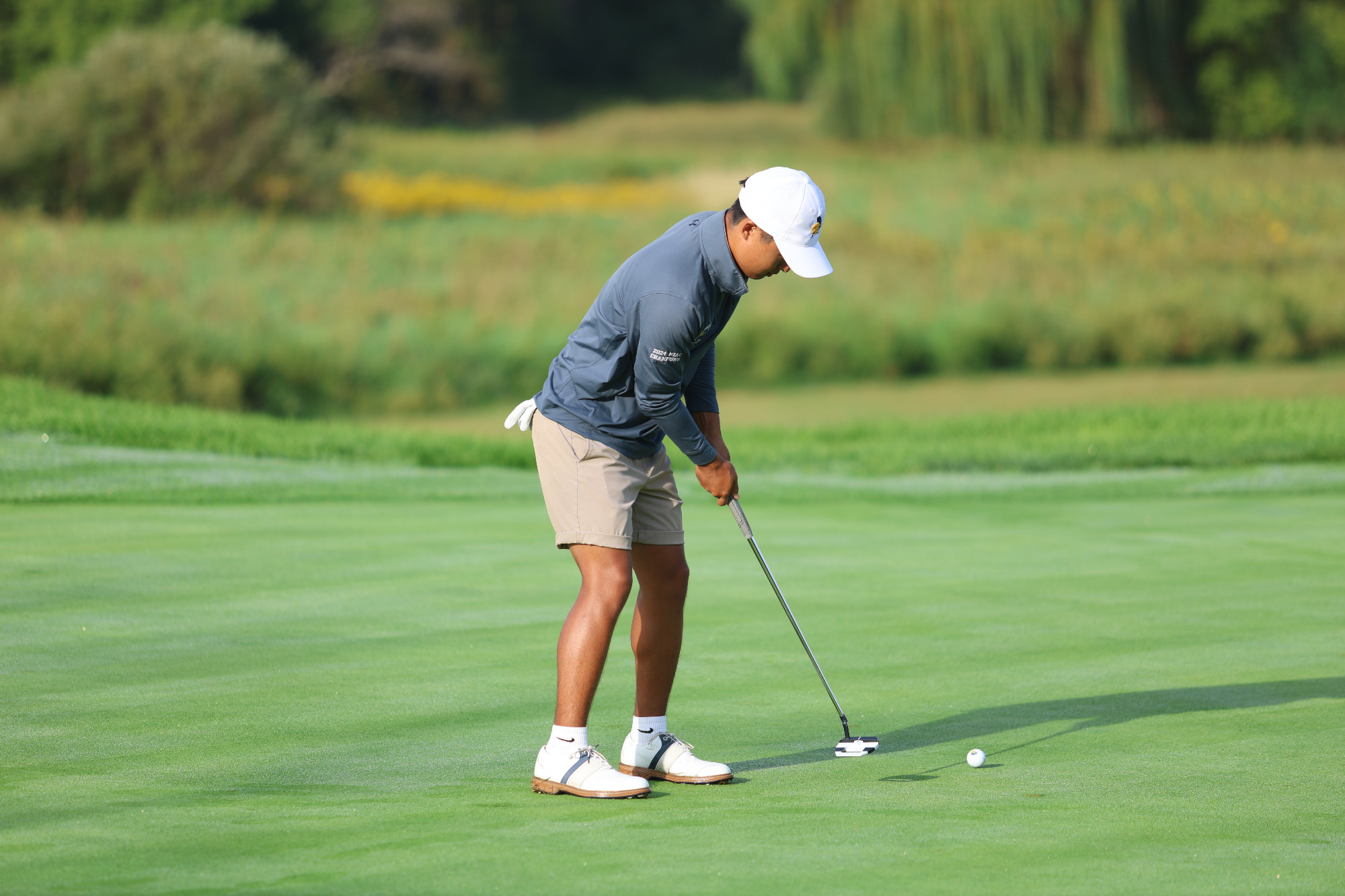 Sam Higaki putting
