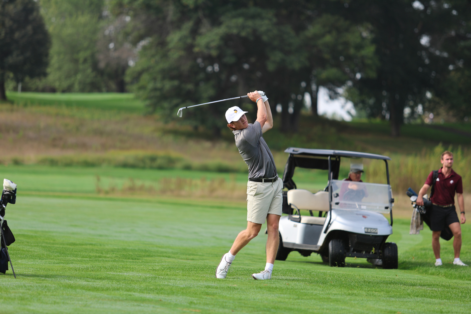 Dillon Croco hitting a shot from the fairway