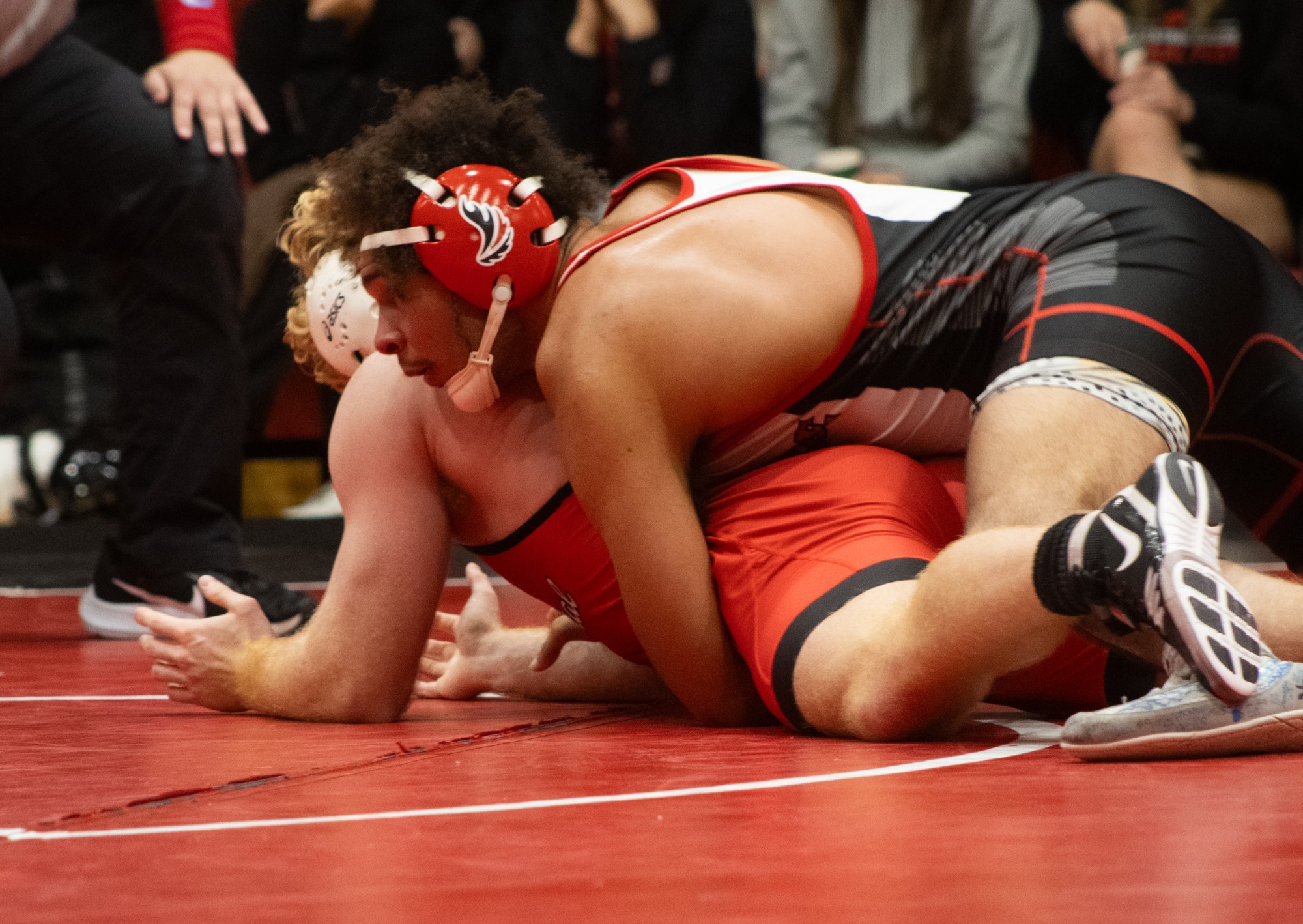London Kiser wrestling against his opponent 