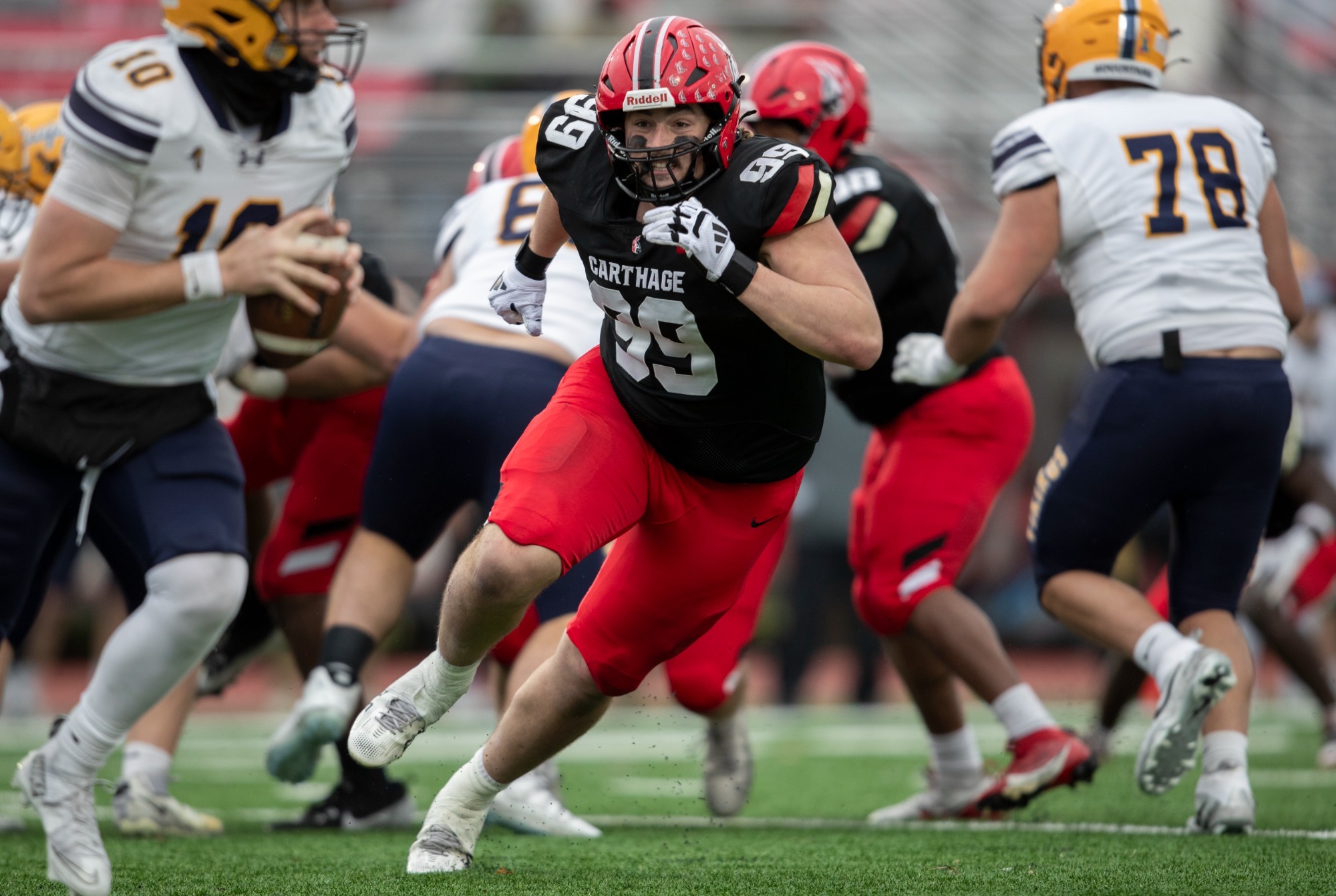 Michael Sneed rushes after the Augustana QB