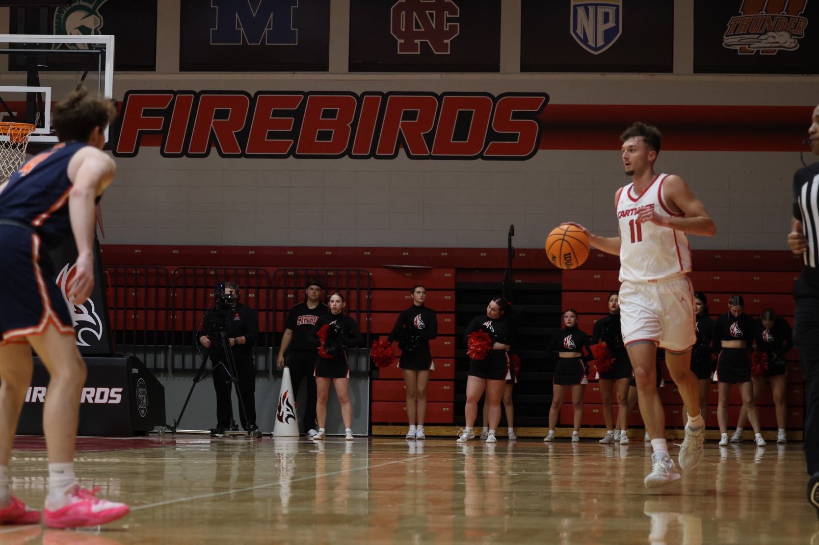 Riley Brooks dribbles up court