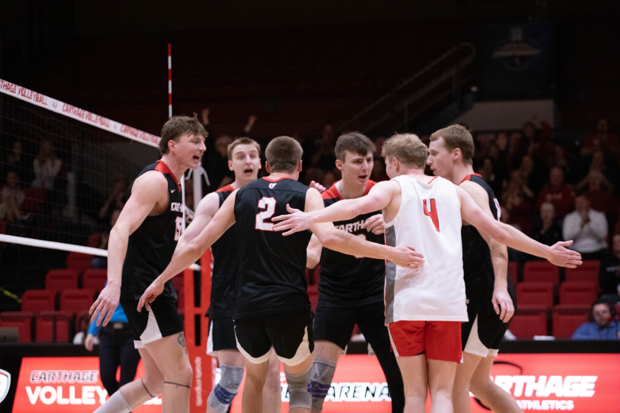 Men's volleyball celebrates after a point