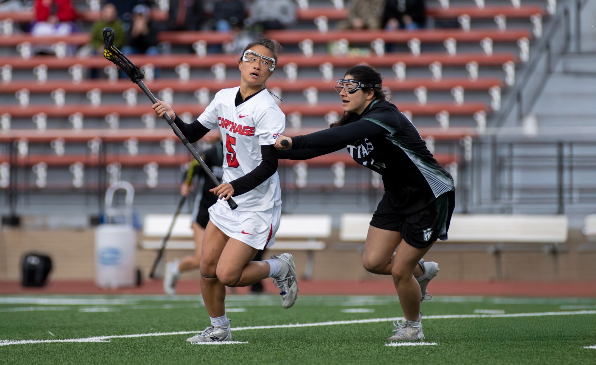 Kim-Hannah works past Illinois Wesleyan defender