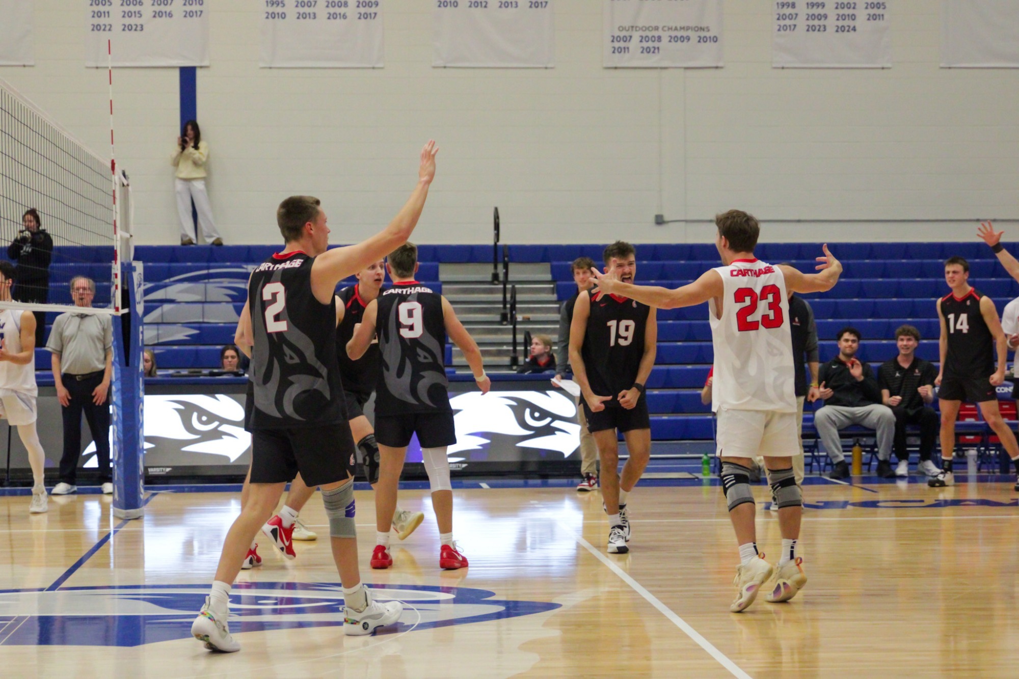 Men's volleyball team celebrates after a point win