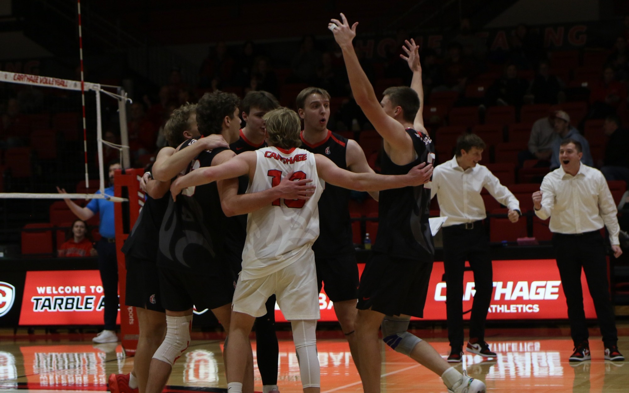 Men's volleyball team celebrates after a point