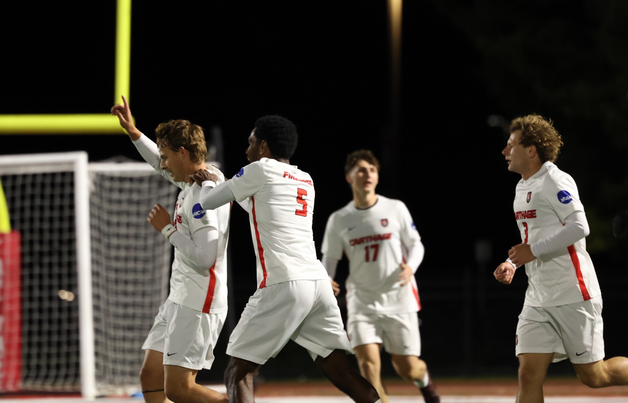 Eli Schoffstall celebrates with his teammates after a goal 