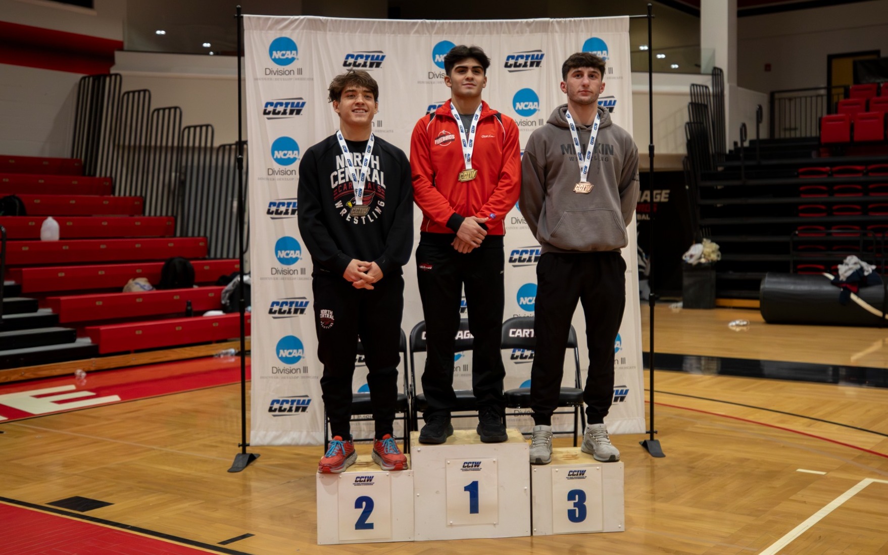 Edgar Albino wins his weight class and stands first on the podium
