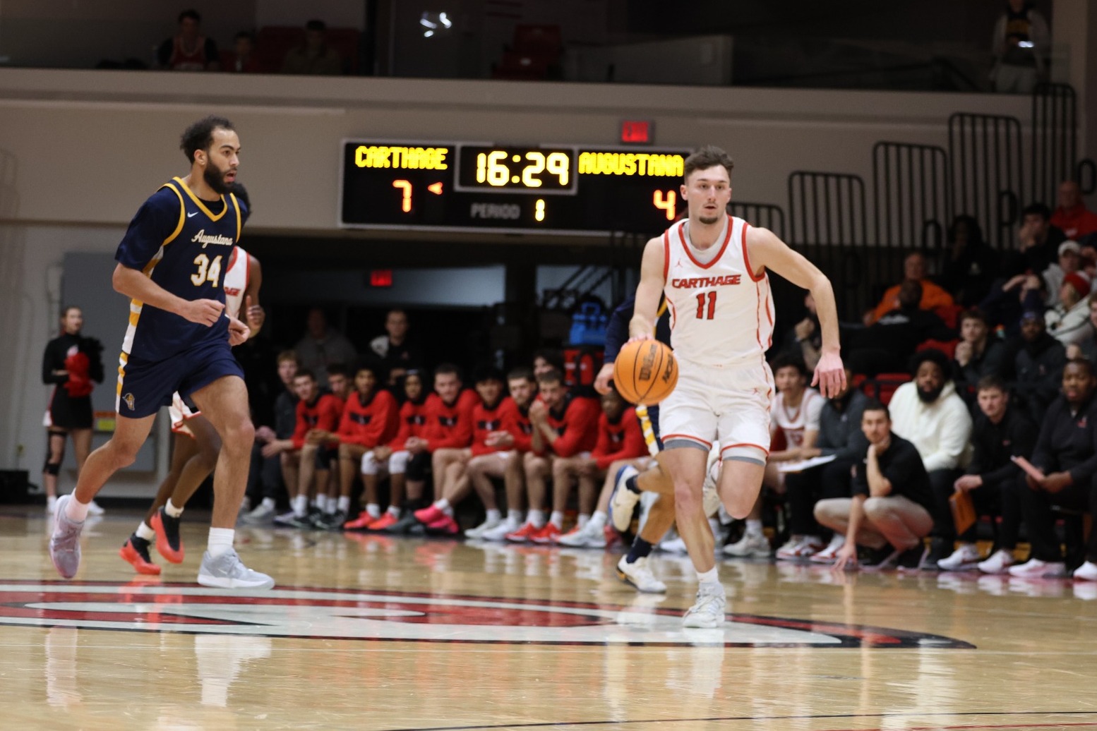 Riley Brooks dribbles up court