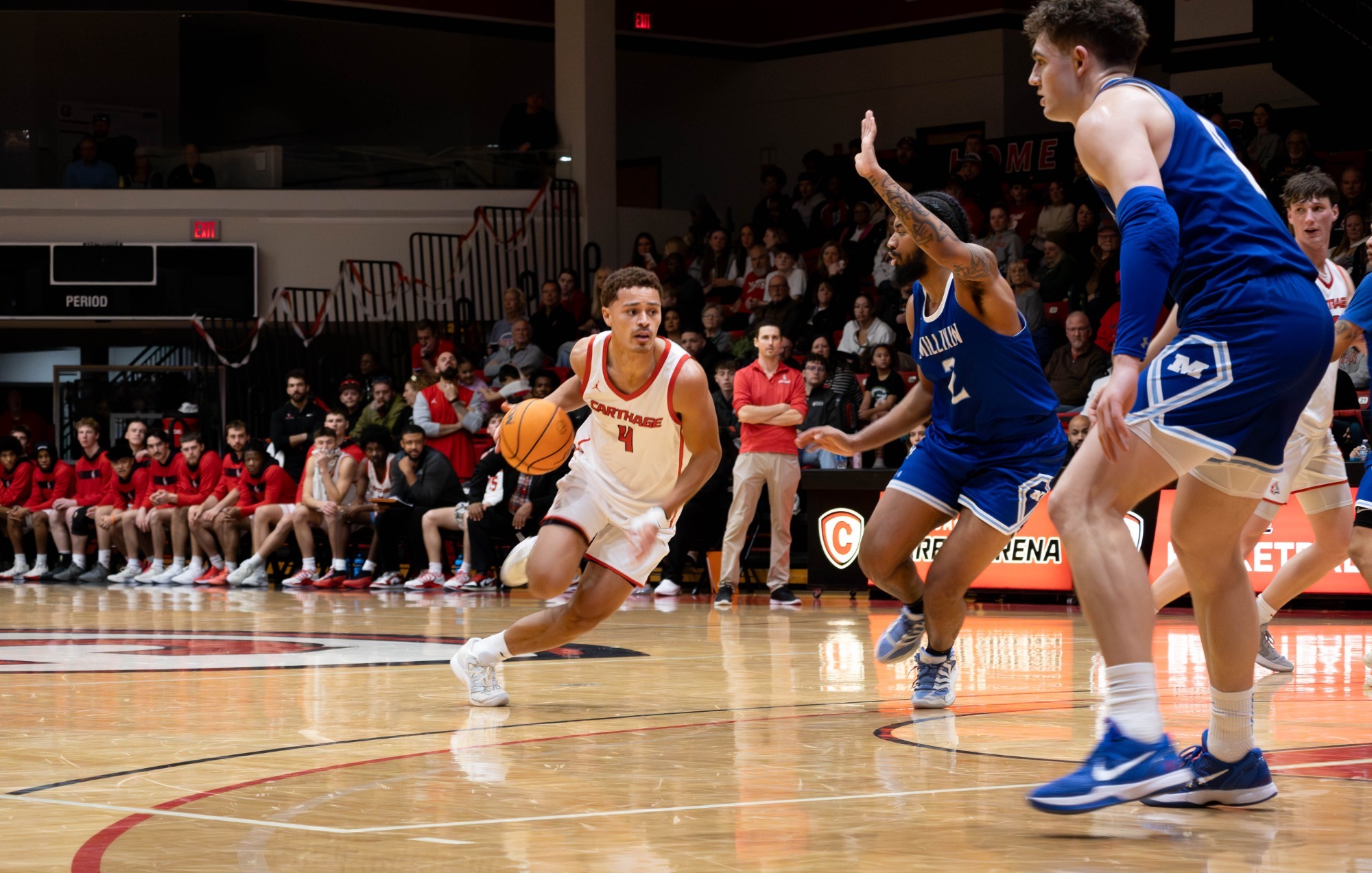 AJ Williams dribbles down the lane against Millikin
