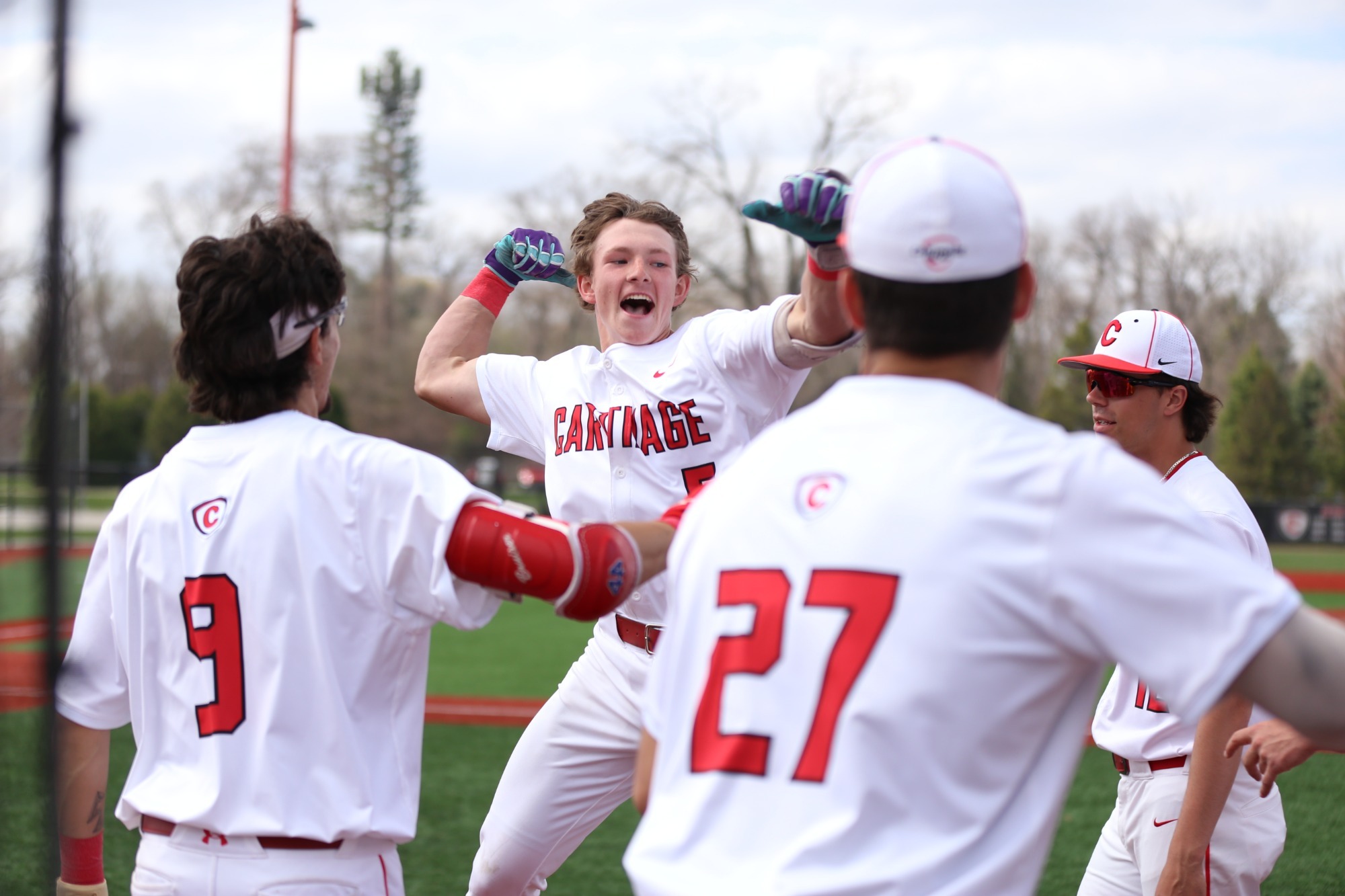 Meyer celebrates with his team after hitting a home run