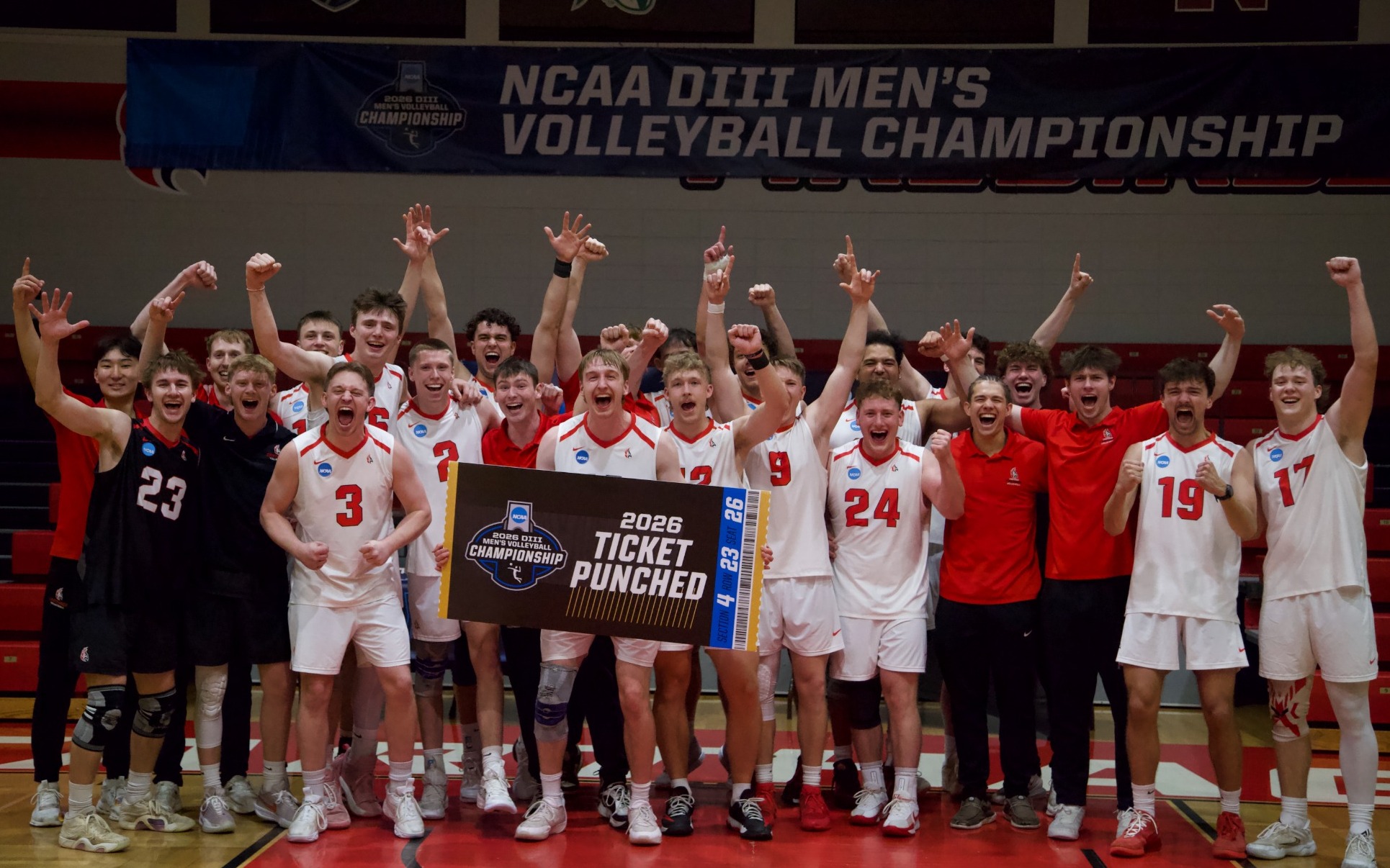 Men's volleyball poses with their ticket punch graphic