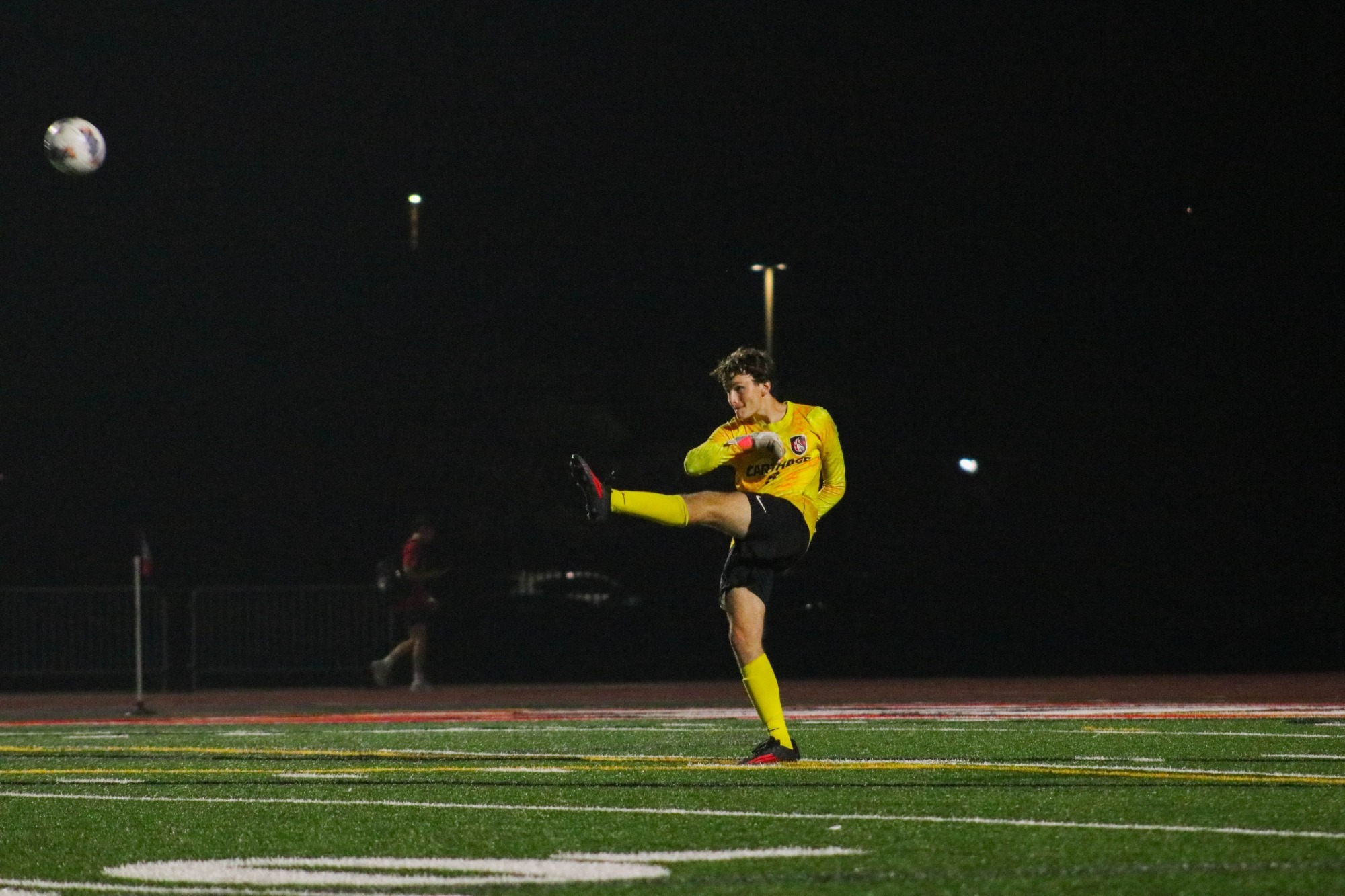 Owen Malinoski kicks the ball after downfield 