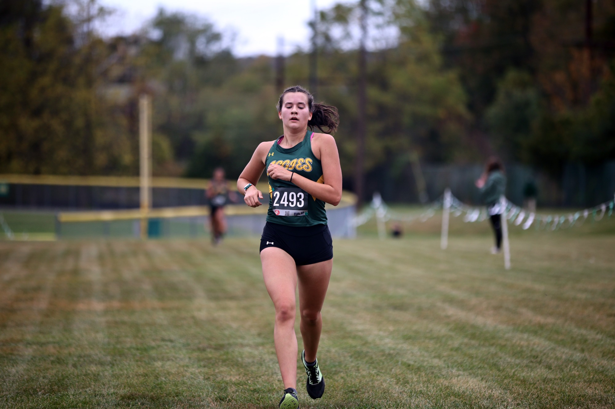 Emma Haas running cross country at the Green & Gold Invite