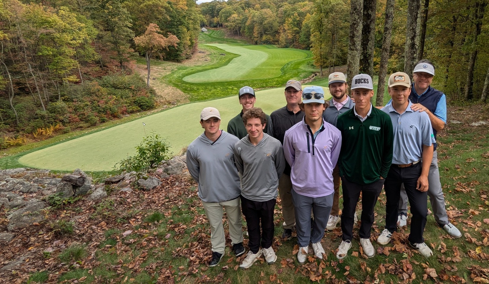 The 2025-26 golf team at Pikewood National Golf Course during their fall trip with DelVal turf grad Joel Foreman who