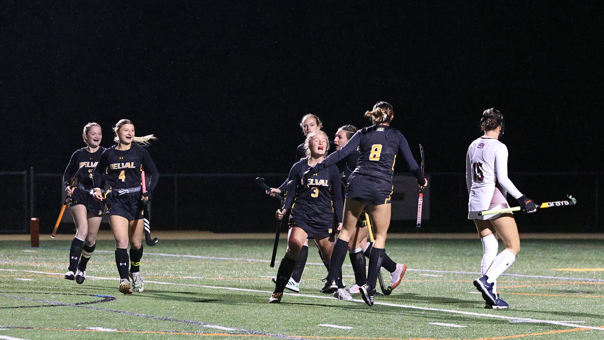 Brynne Miller and team celebrating goal in field hockey game vs. FDU-Florham