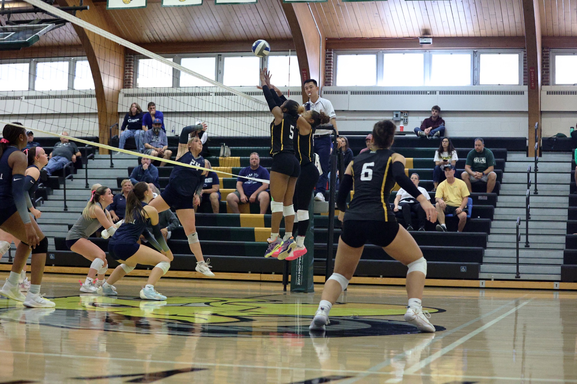 Kai Logan and Madison Alexander playing women's volleyball vs. Penn State Schuylkill